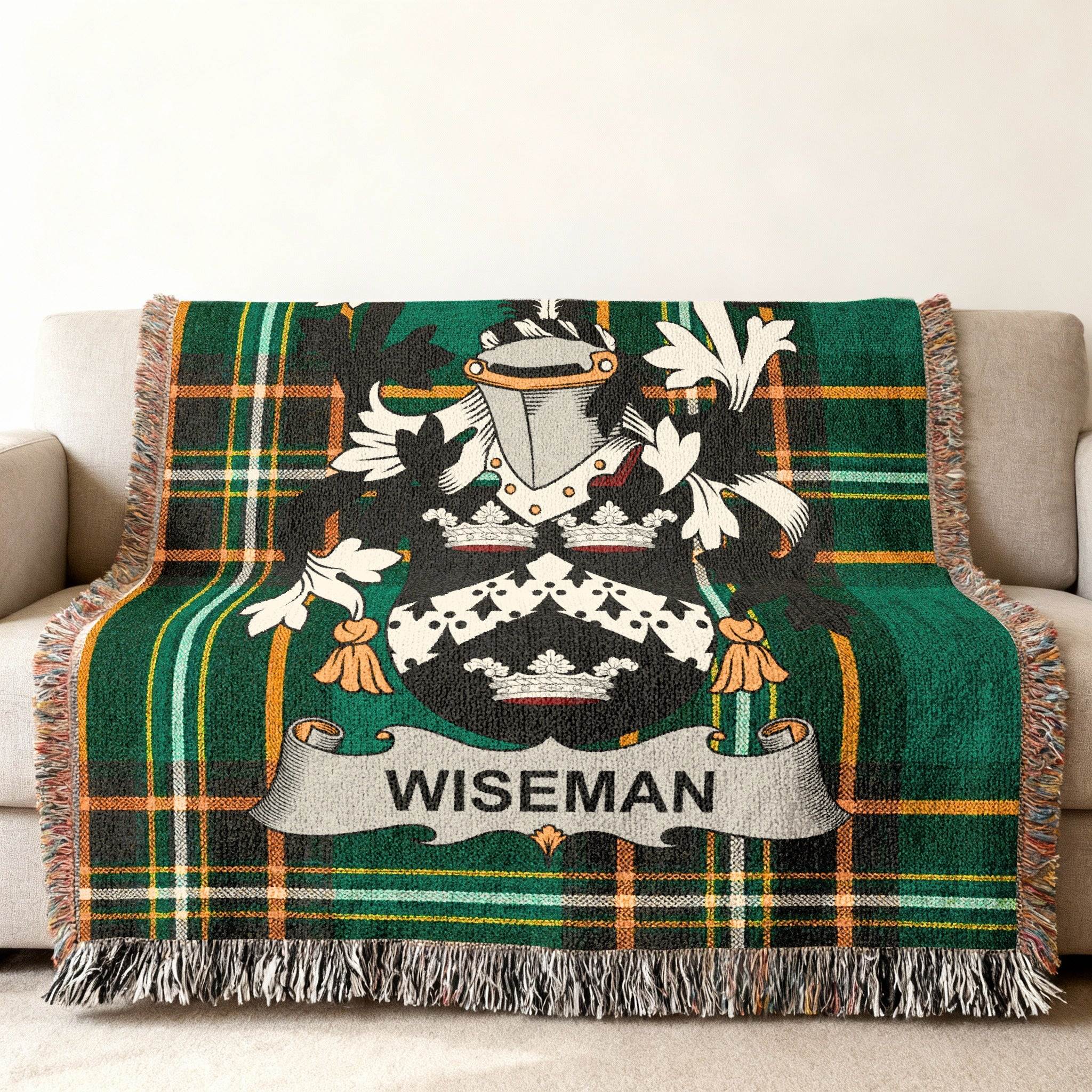 Woven blanket with Wiseman family crest and green tartan pattern.