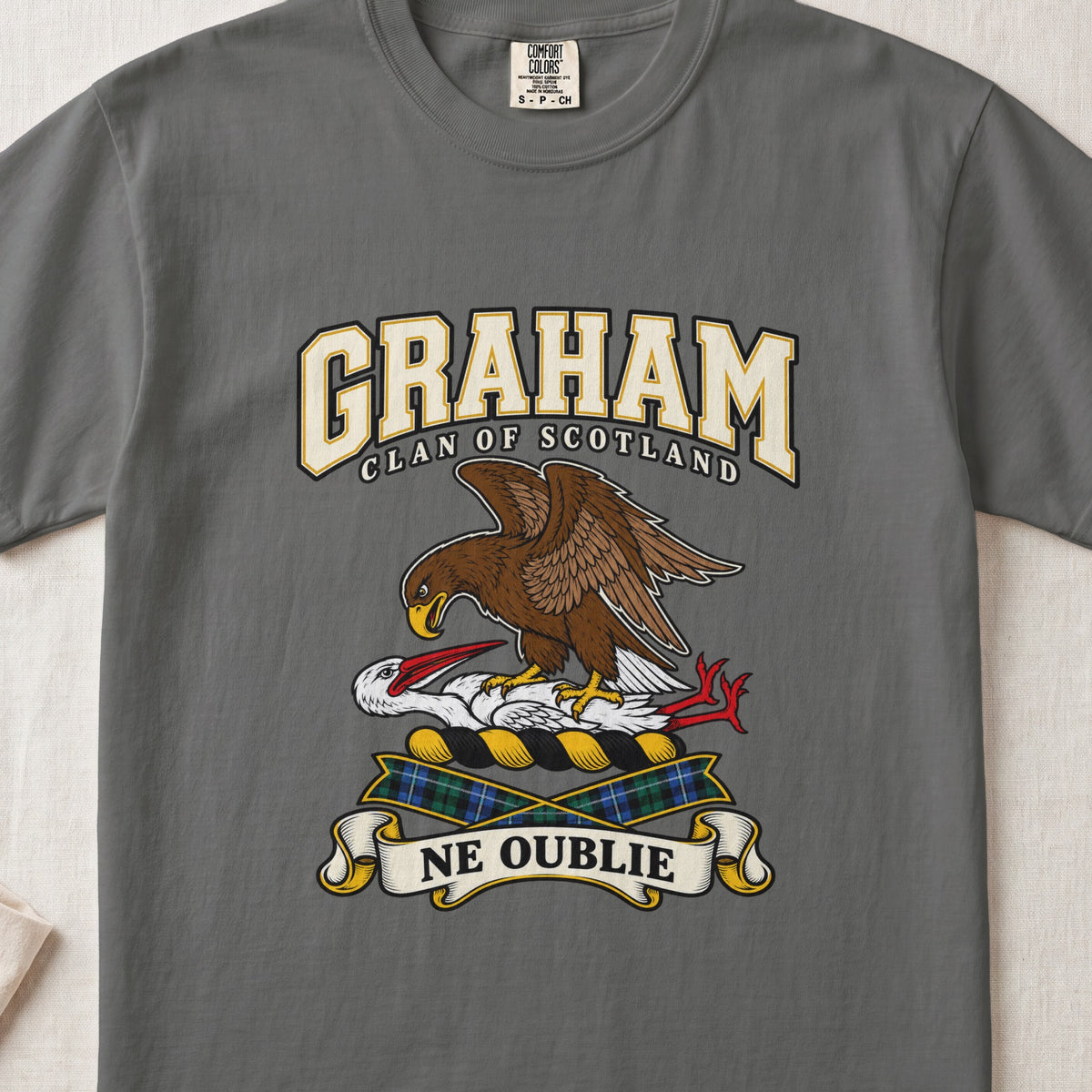 Graham graphic T-shirt in Pepper gray, front flat lay showing varsity lettering and brown eagle-like bird over a white long-necked bird with red beak and legs.