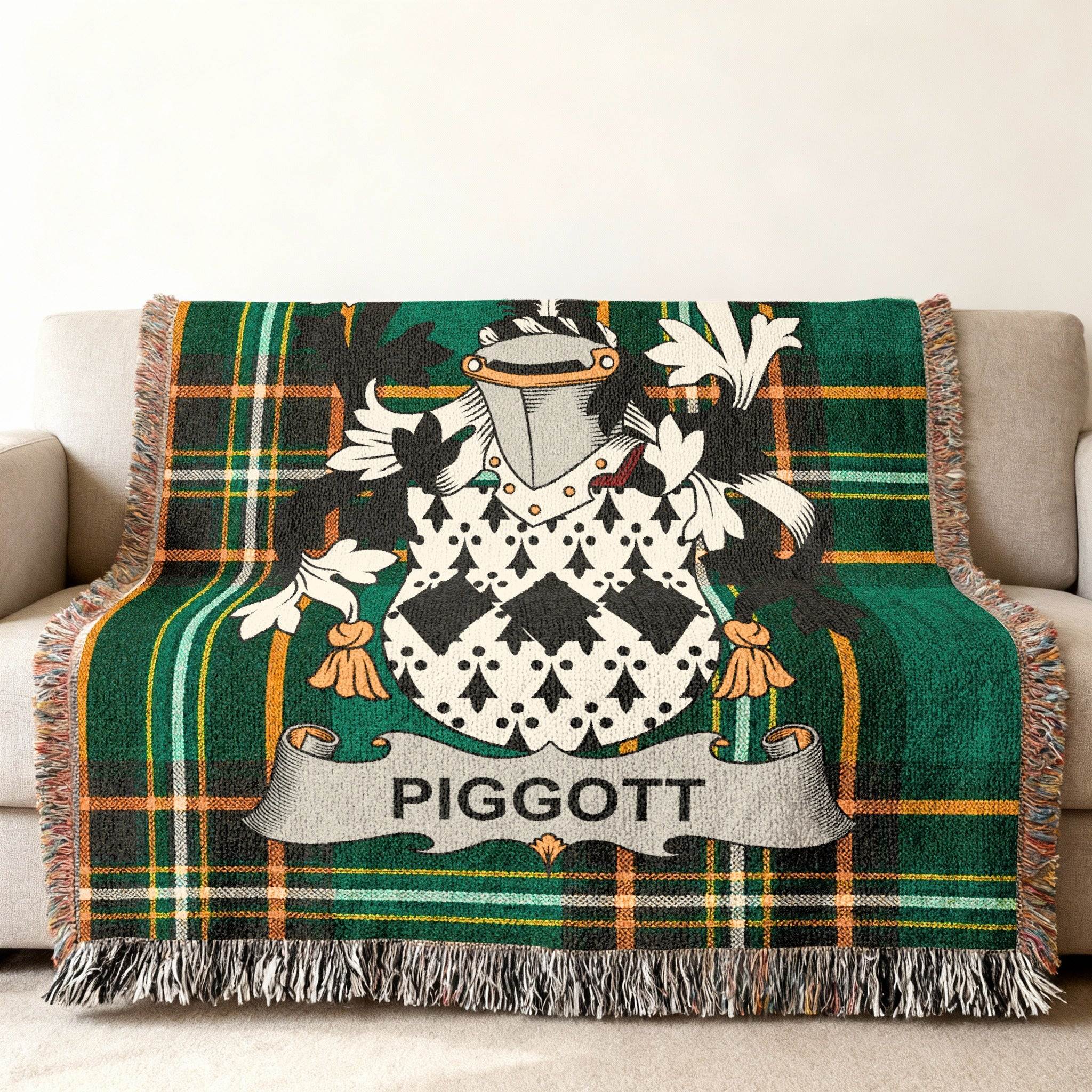 Tartan blanket with PIGGOTT family crest and shield.