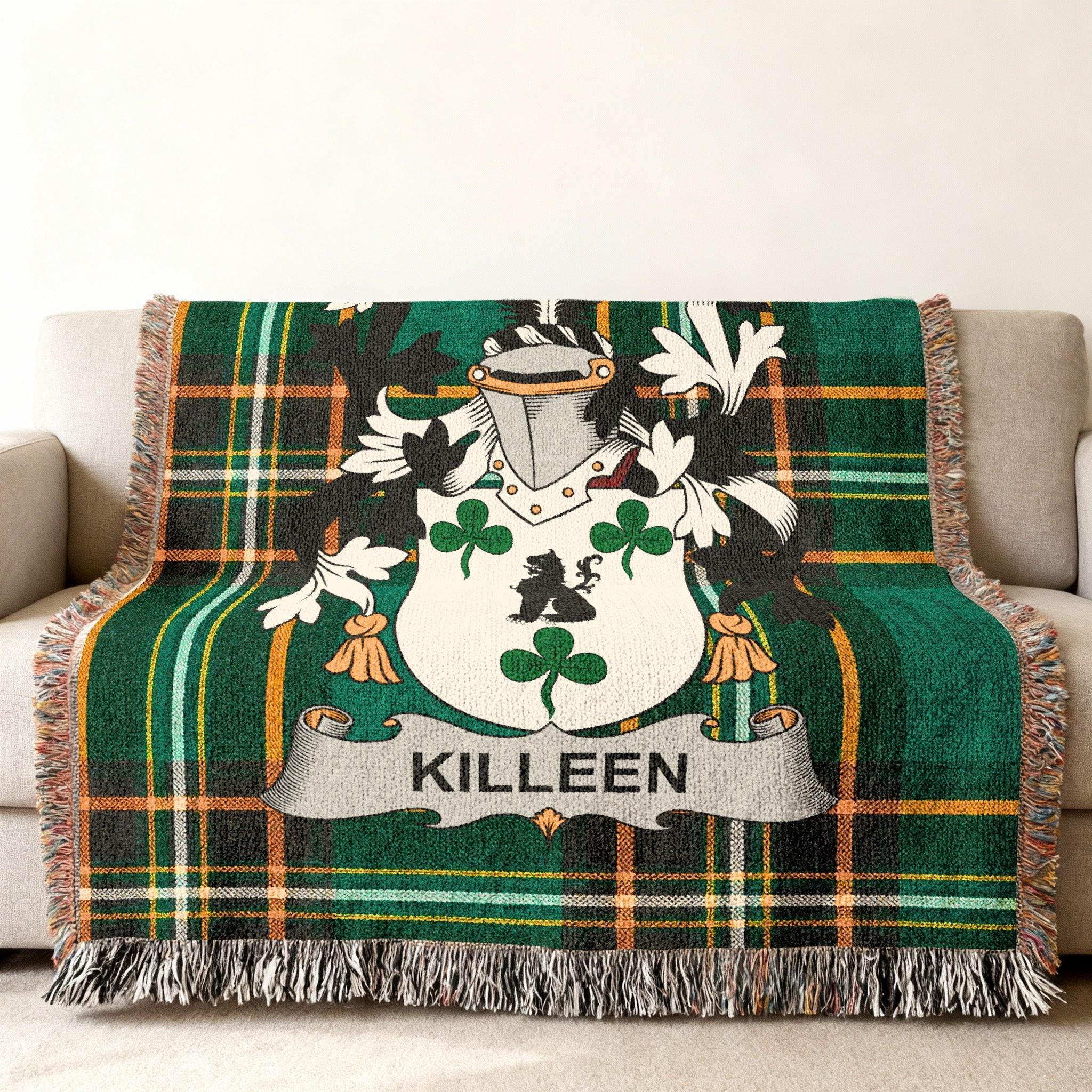 Green tartan blanket with Killeen family crest displayed.