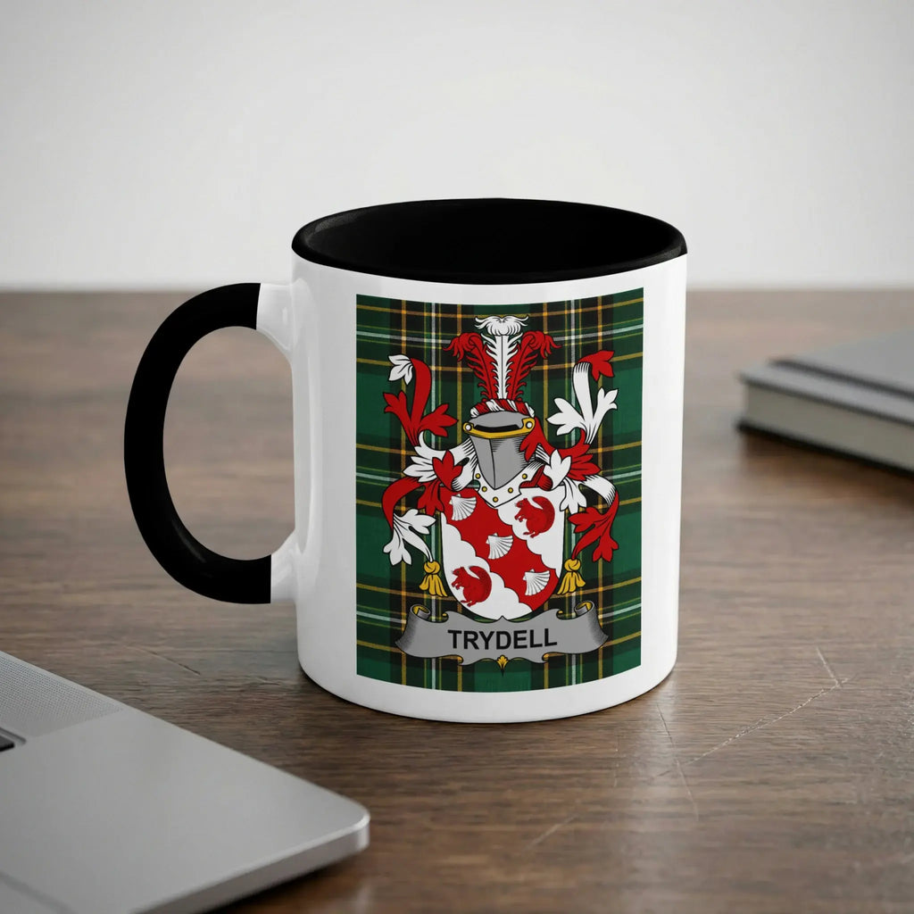 White mug with black handle displaying the Trydell family crest on a plaid background.