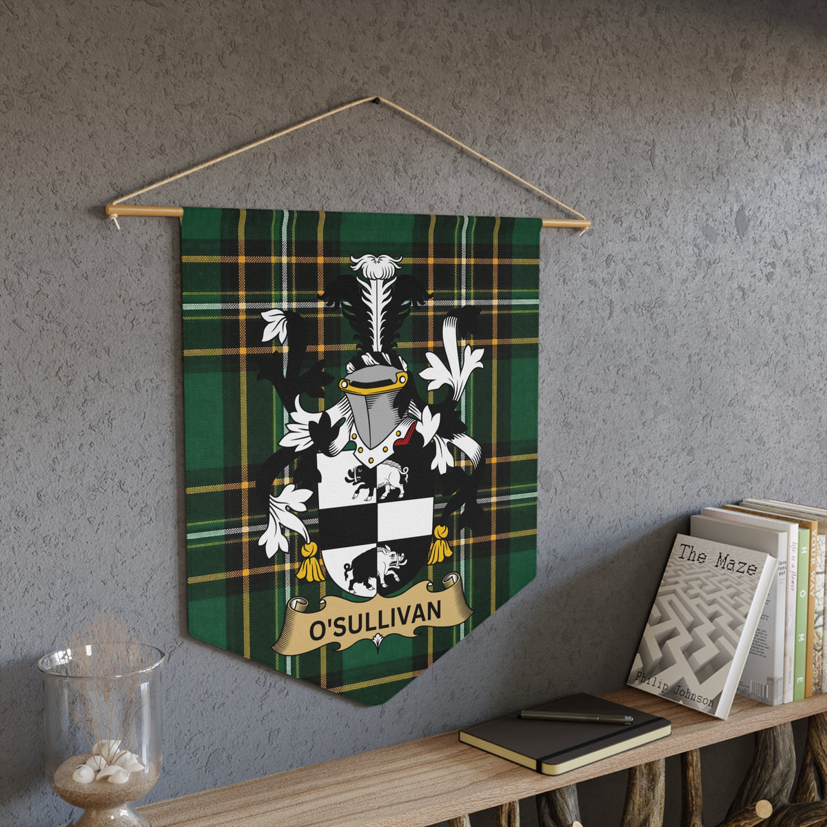 O'Sullivan family crest on green tartan pennant banner hanging on wall.