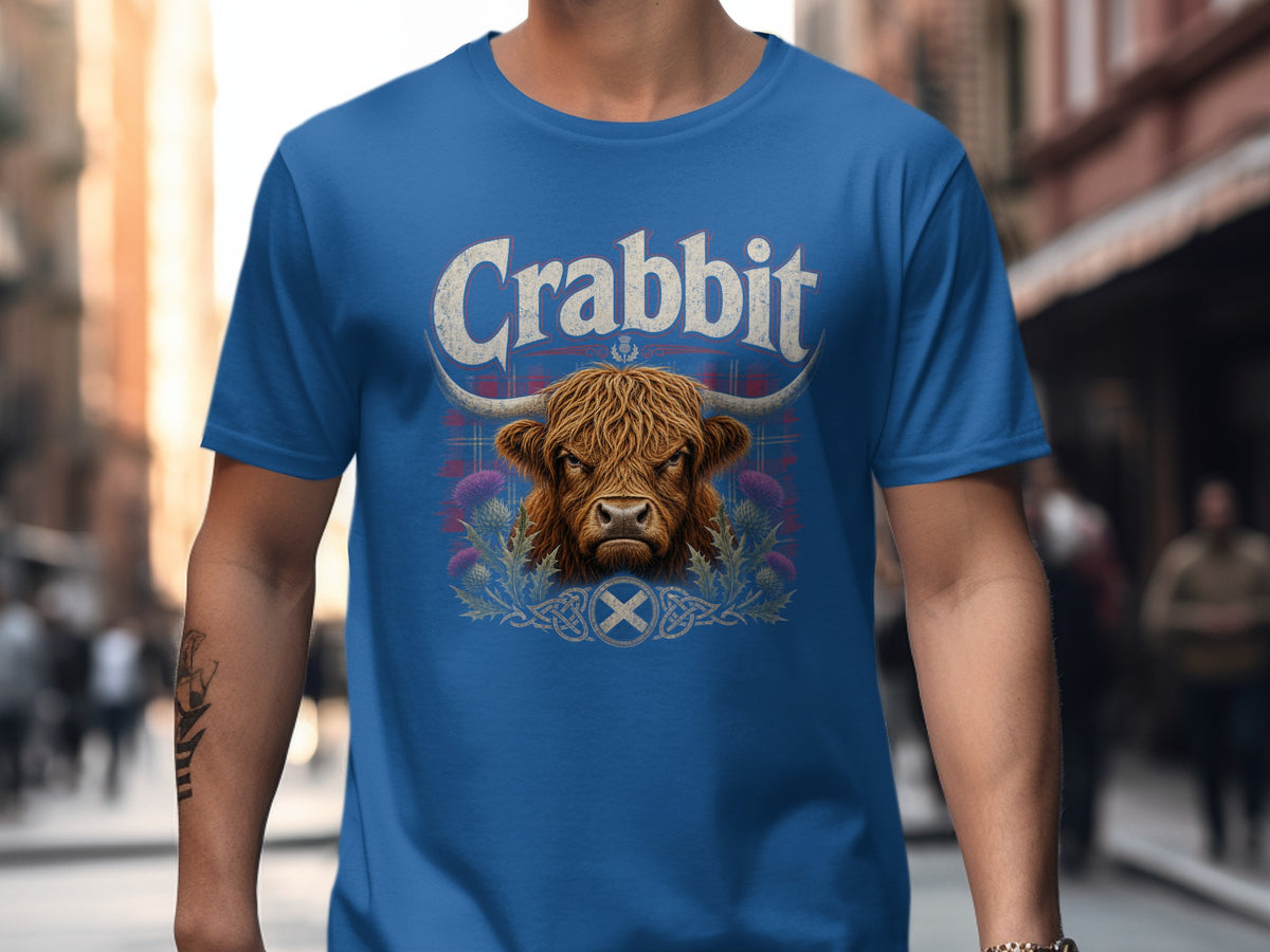 Blue t-shirt with "Crabbit" text over a Highland cow and thistles.