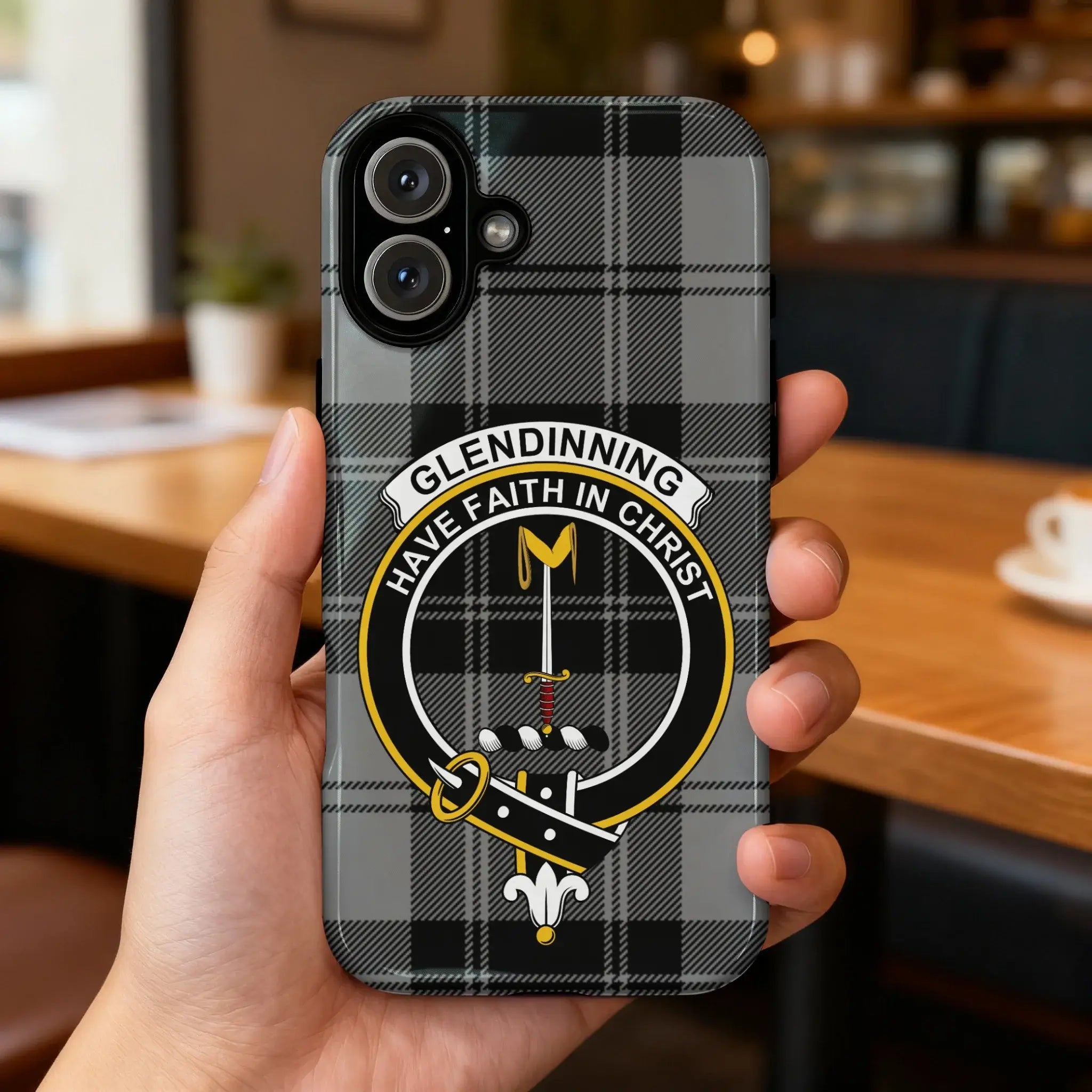 Glendinning tartan phone case on iPhone — full-wrap crest design showing tartan pattern, rear view