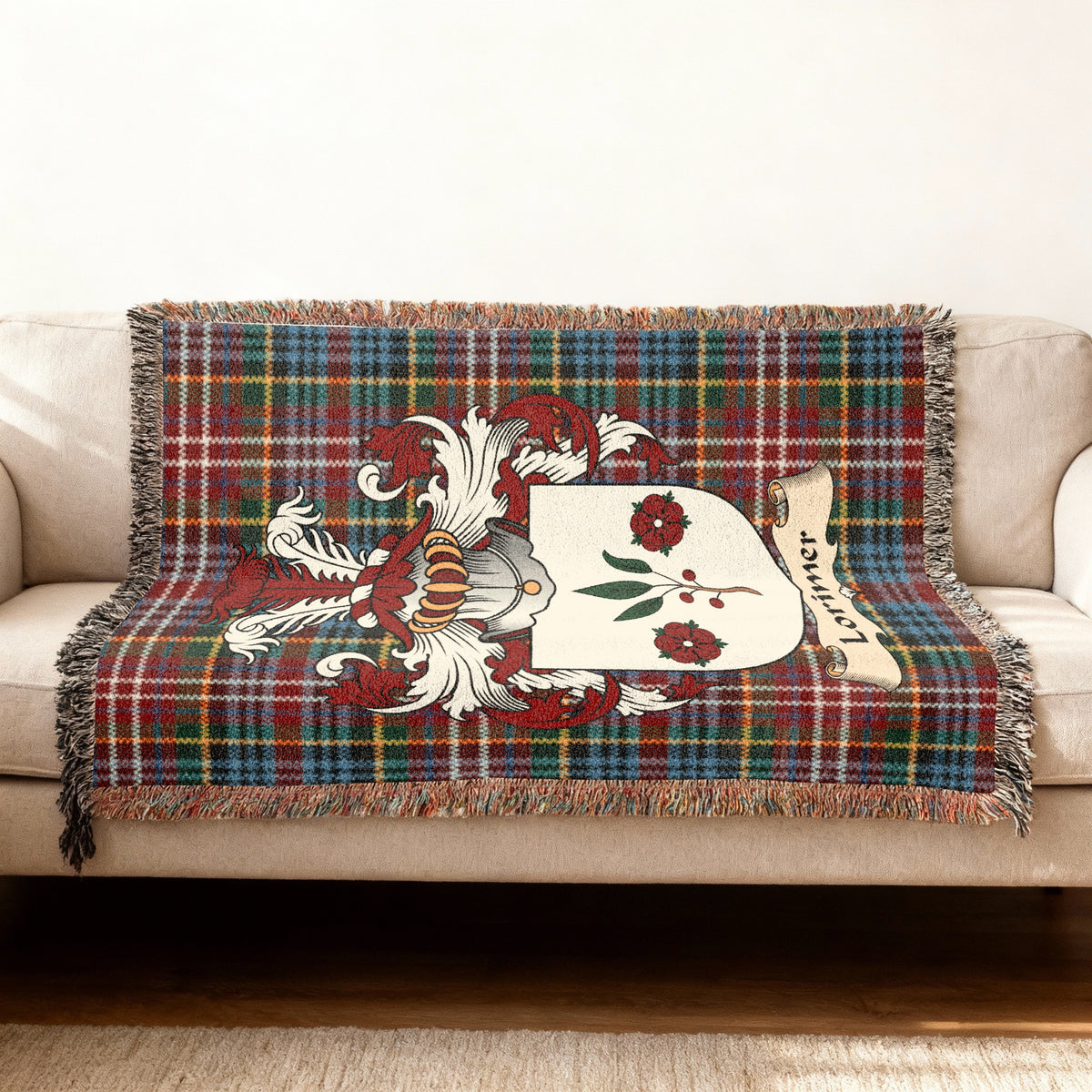 Lorimer Scottish woven blanket with family shield and Caledonia tartan background
