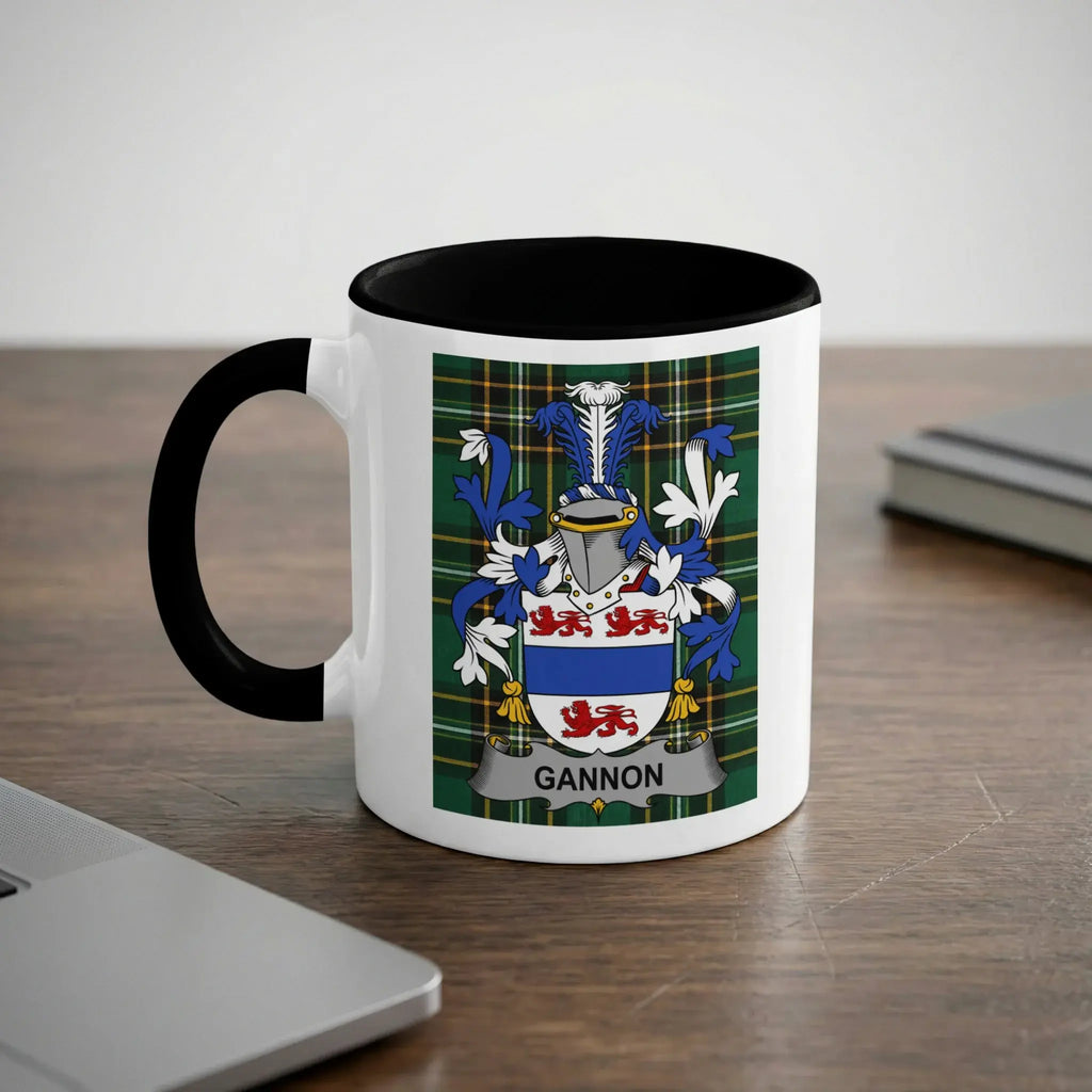 White mug with black rim featuring the Gannon family crest on a tartan background.
