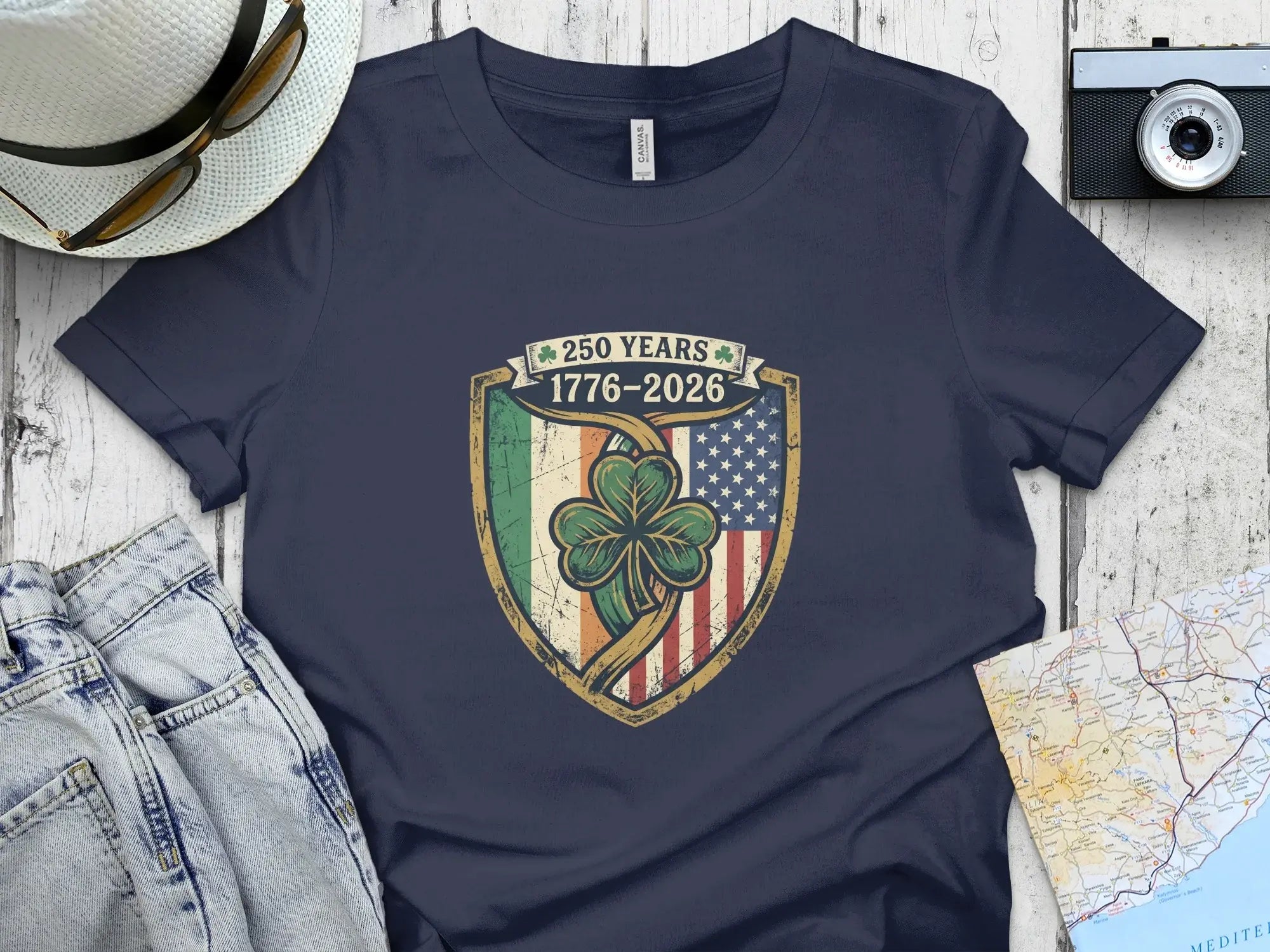 Navy t-shirt with a shield logo celebrating 250 years: 1776-2026.