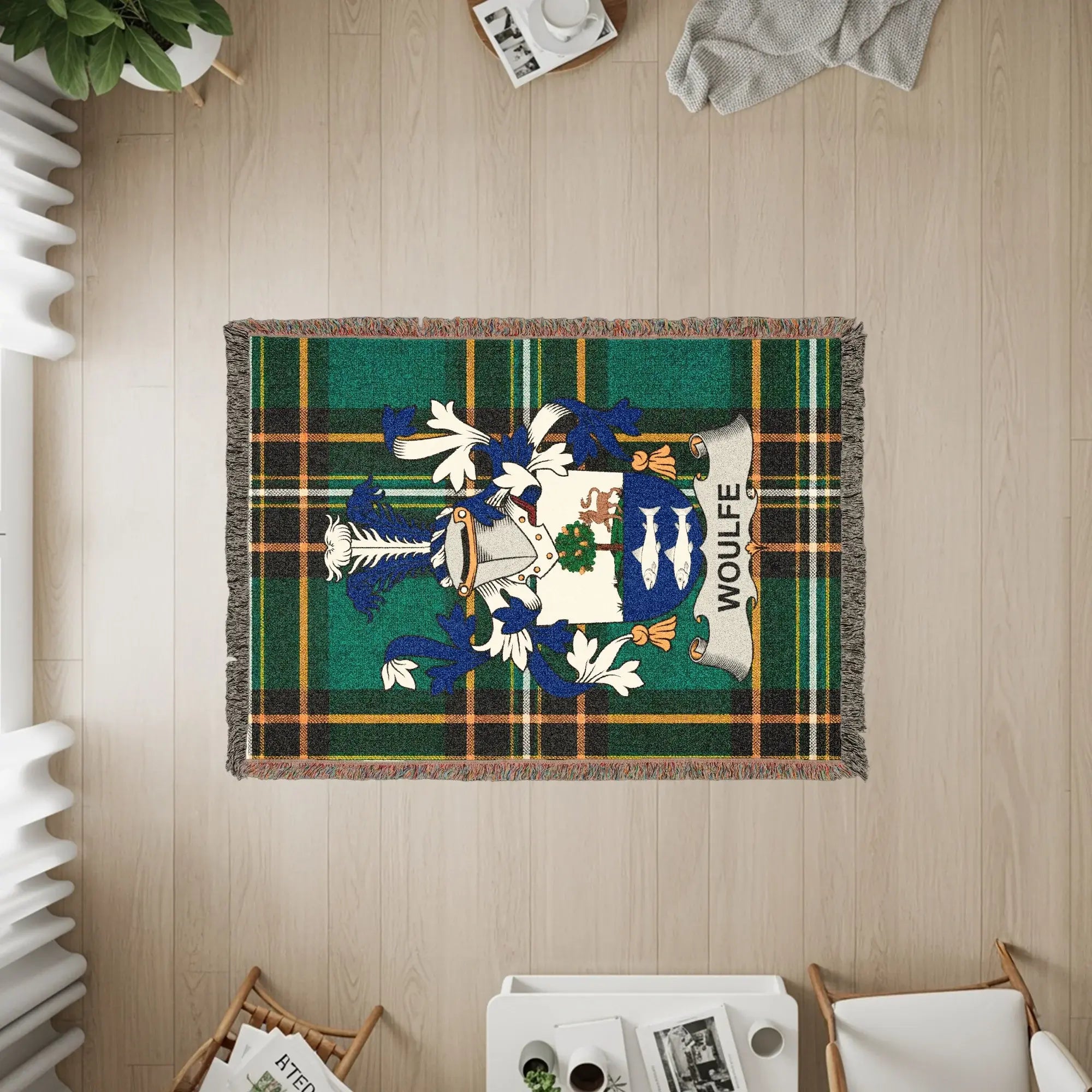 Woulfe family crest woven into a green plaid blanket with fringe.