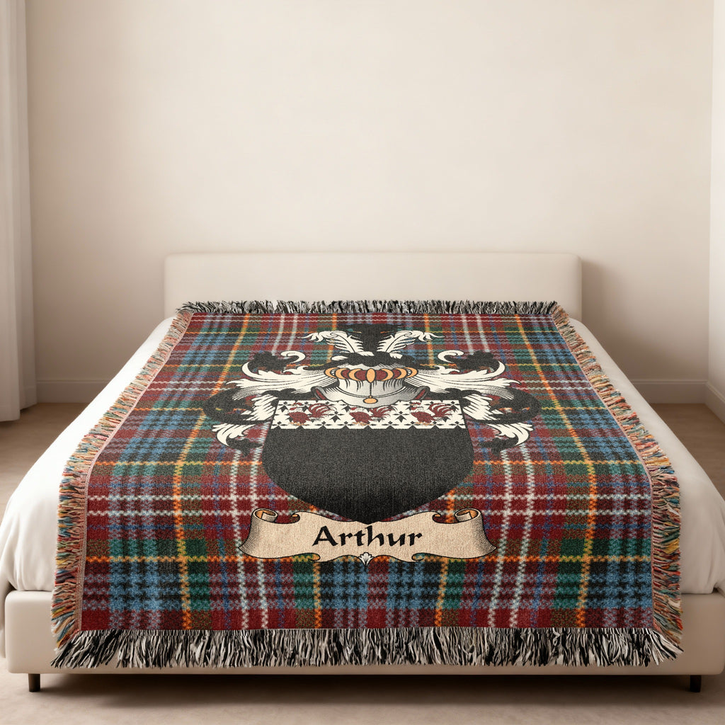 Arthur family crest emblem on a Caledonia tartan woven blanket