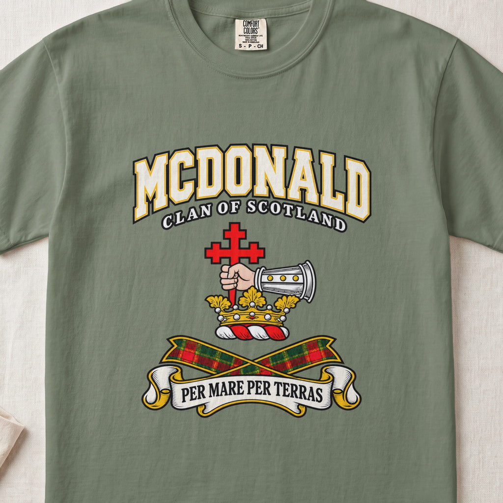 McDonald graphic T-shirt in Moss green, front flat lay showing varsity lettering and armoured forearm with hand holding red cross.