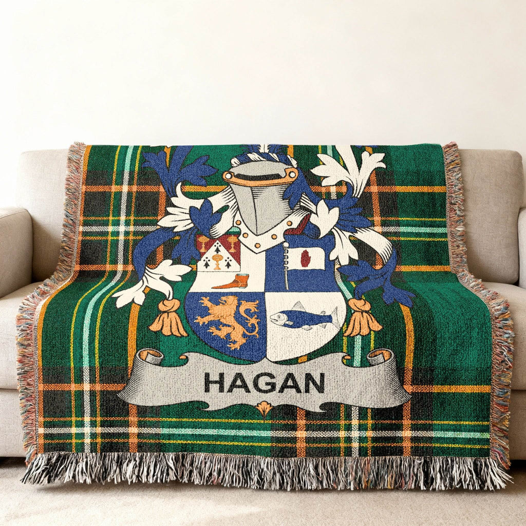 Tartan blanket featuring the Hagan family crest with a lion and fish.