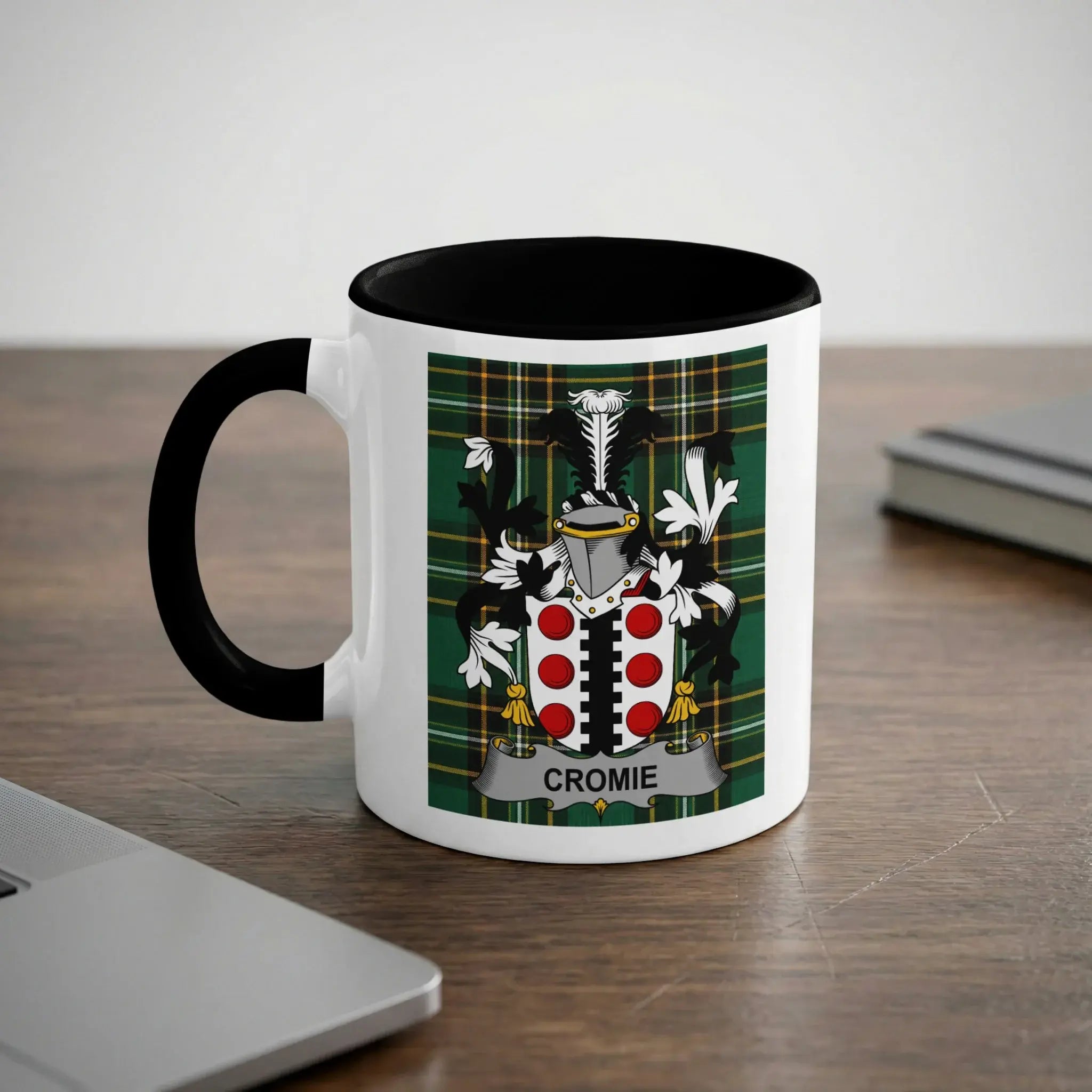White mug with black handle featuring the Cromie family crest.
