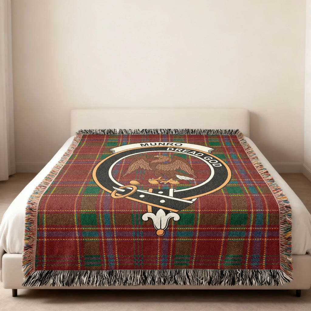 Munro Dread God clan crest Scottish tartan woven blanket folded — eagle crest on cotton plaid