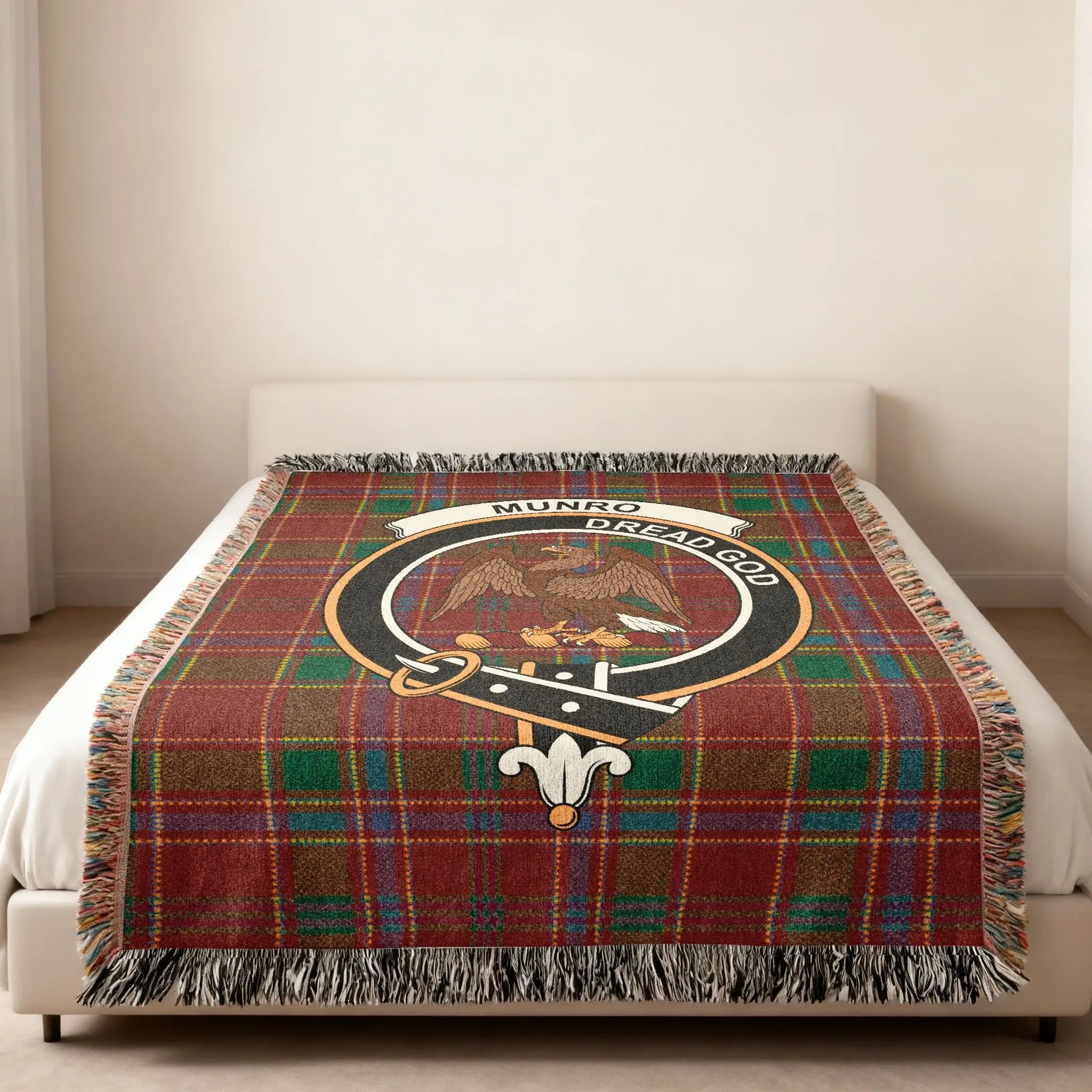 Munro Dread God clan crest Scottish tartan woven blanket folded — eagle crest on cotton plaid