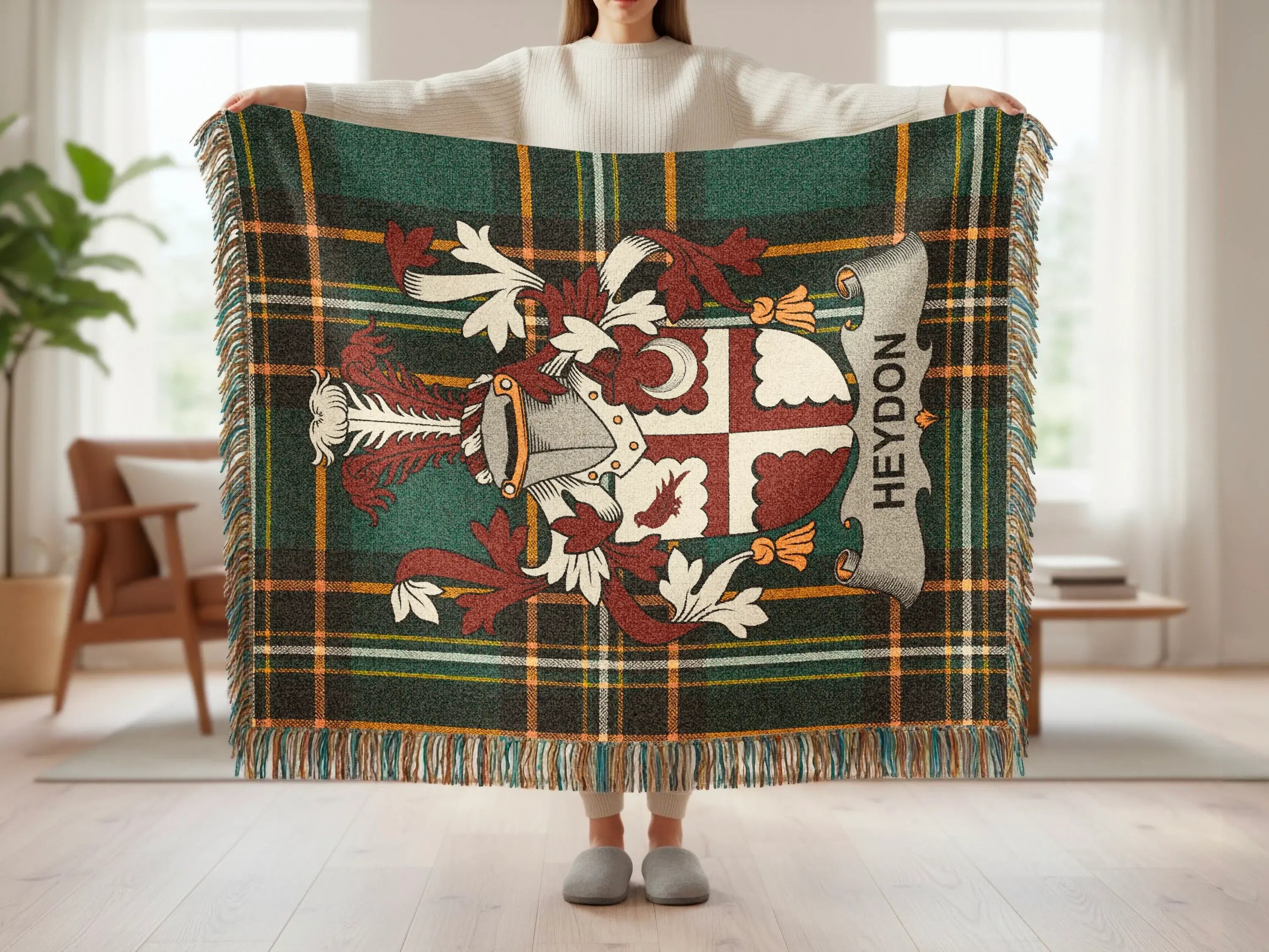 Tartan blanket with heraldic crest and "Heydon" banner.