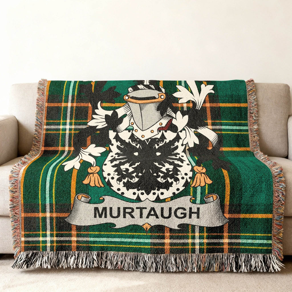 Green tartan throw blanket with the Murtagh family crest prominently displayed.
