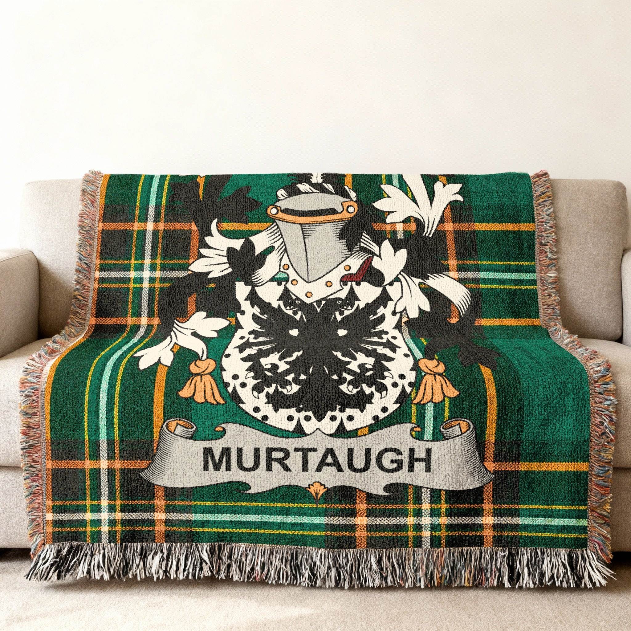 Green tartan throw blanket with the Murtagh family crest prominently displayed.