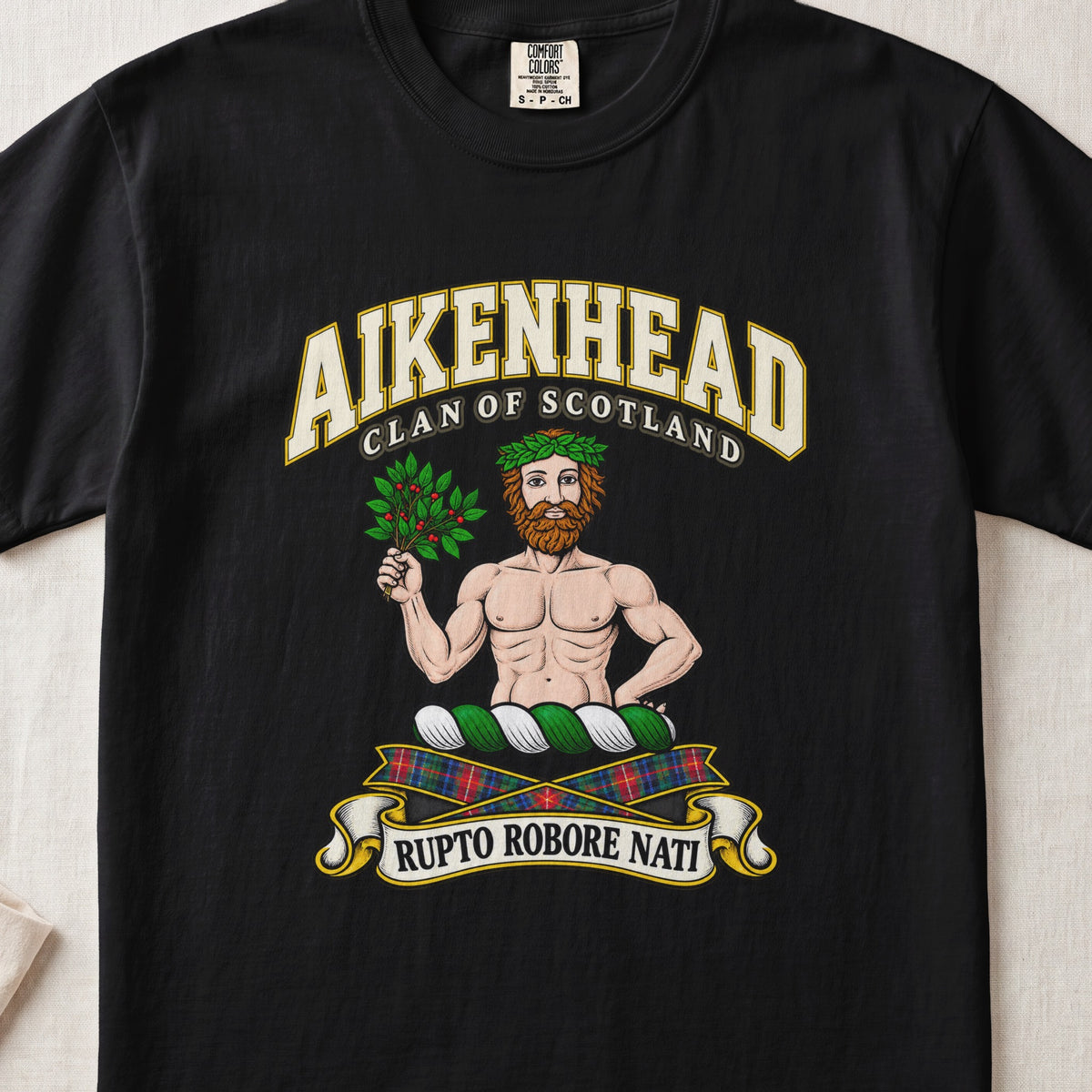 Aikenhead Scottish clan T-shirt in Black, front view with a bearded figure holding a leafy branch and motto banner.