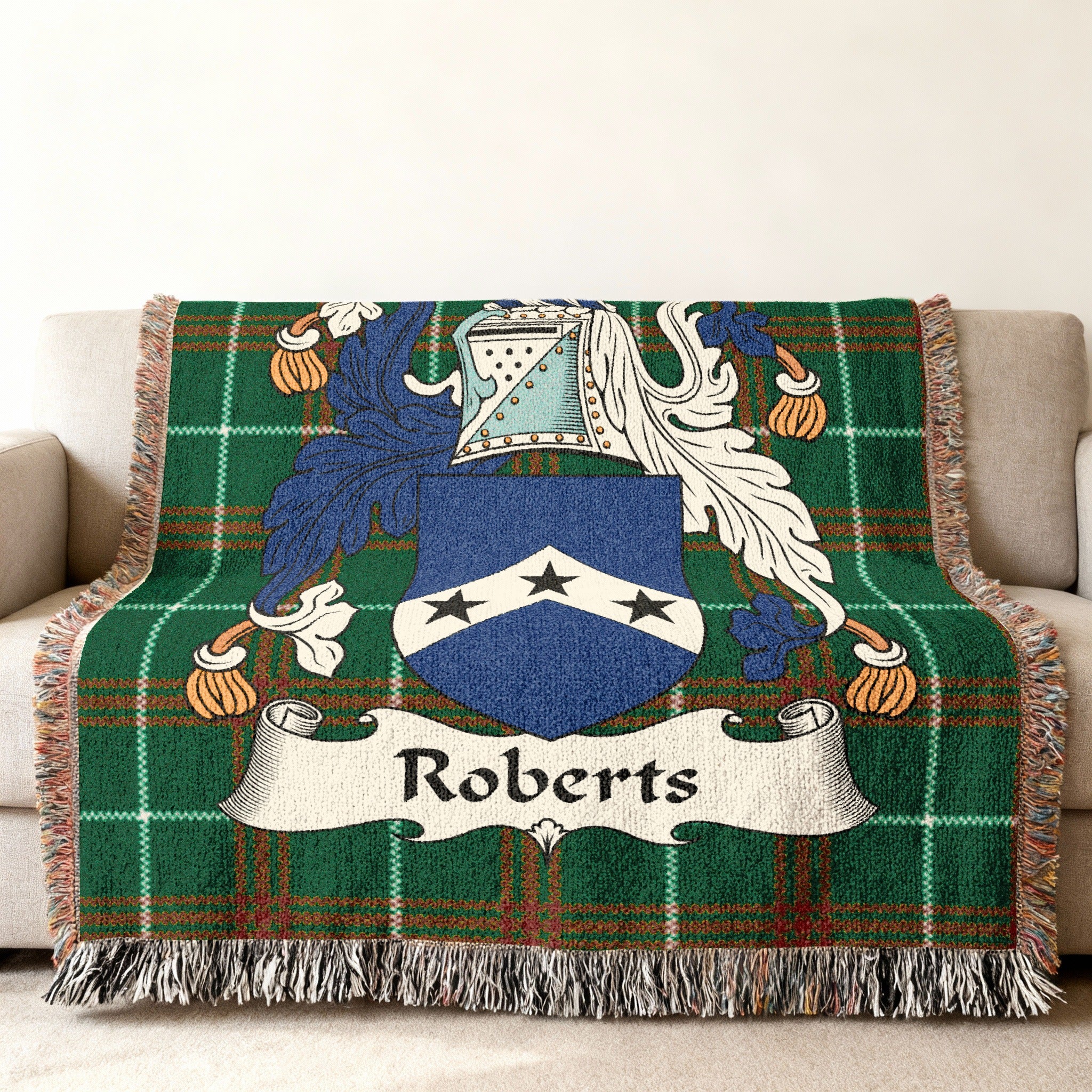 Roberts family crest woven throw blanket on couch.