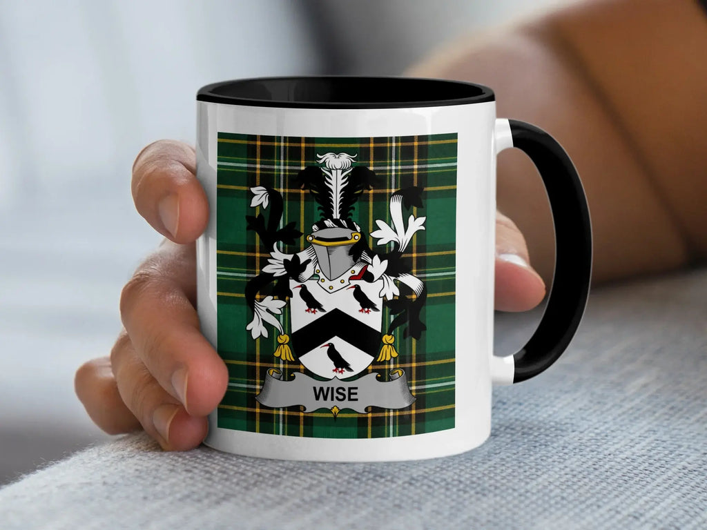 White mug with black rim displaying a coat of arms with the name "WISE" on a banner.