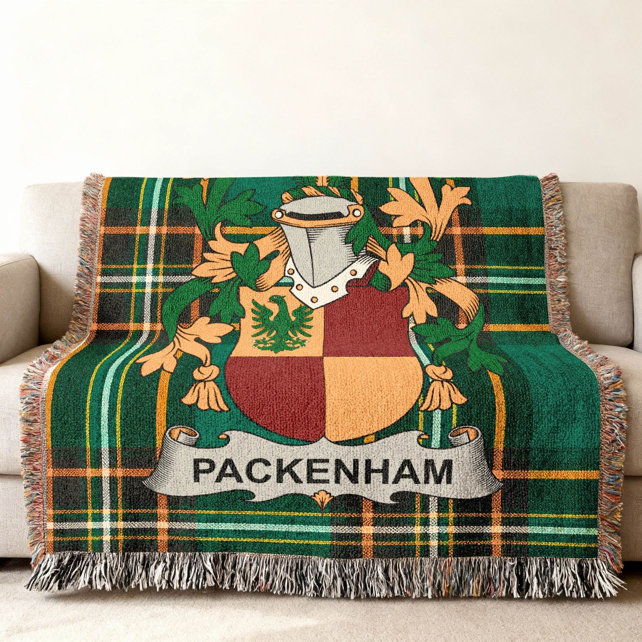 Green tartan blanket with a family crest and "PACKENHAM" text.