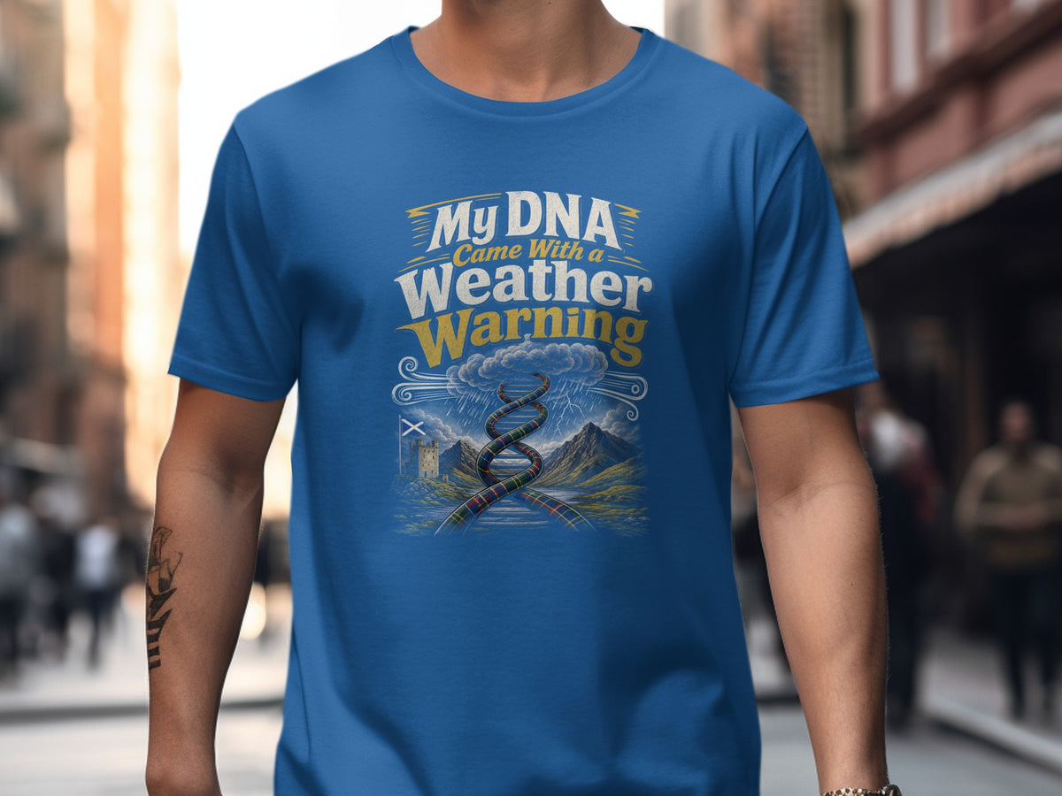 Blue t-shirt featuring text "My DNA Came With a Weather Warning" over a stormy landscape.
