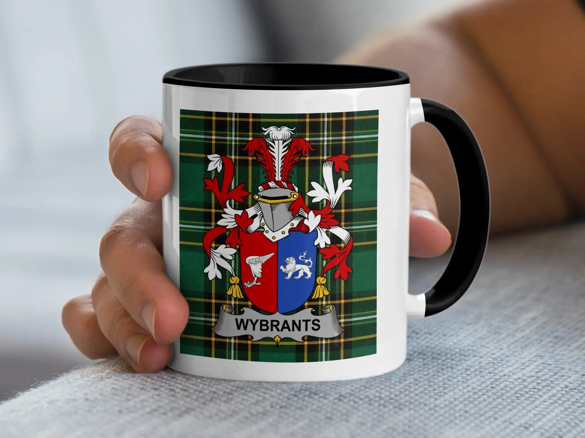 White mug with black rim featuring the Wybrants coat of arms on a plaid background.