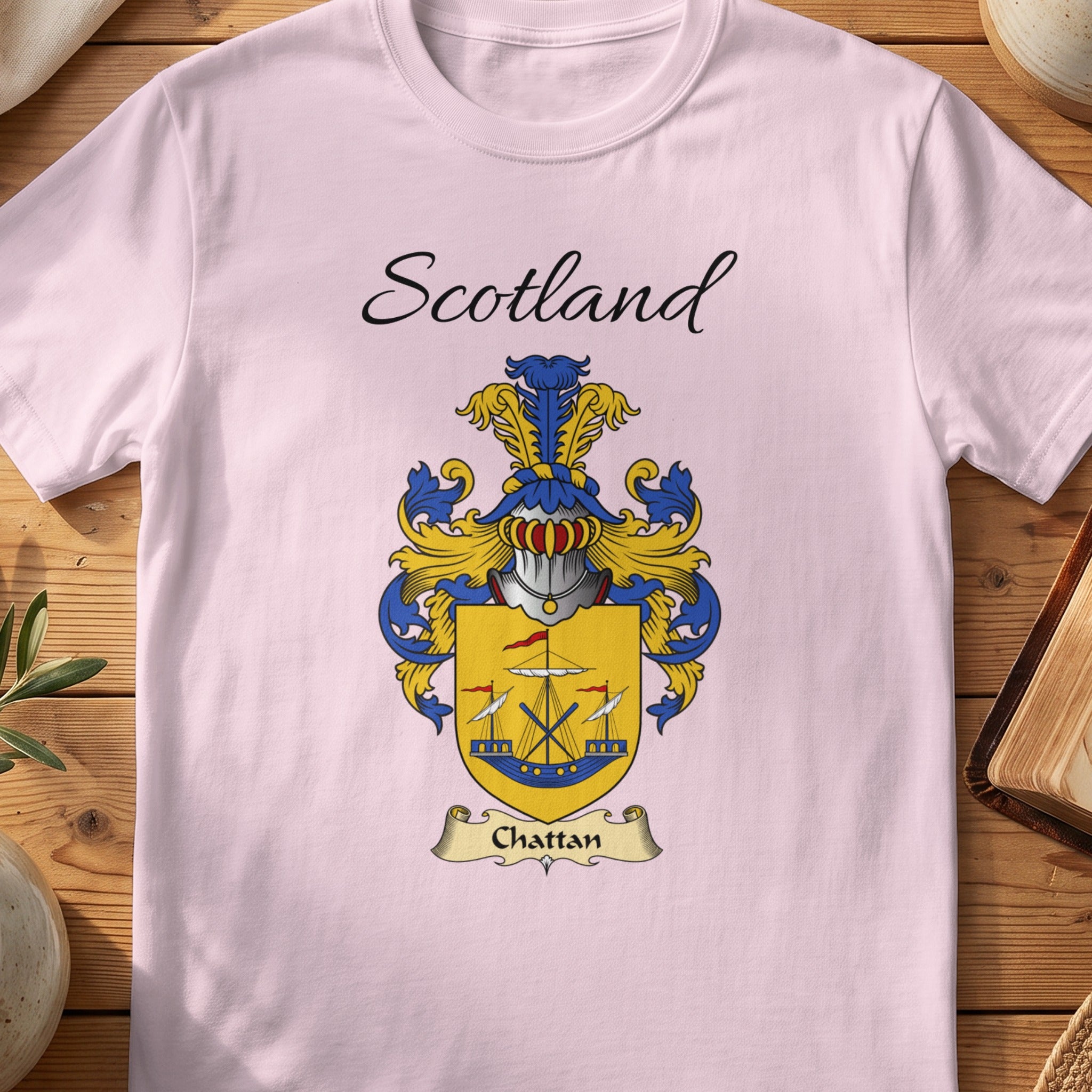 Pink t-shirt with "Scotland" and the Chattan coat of arms.