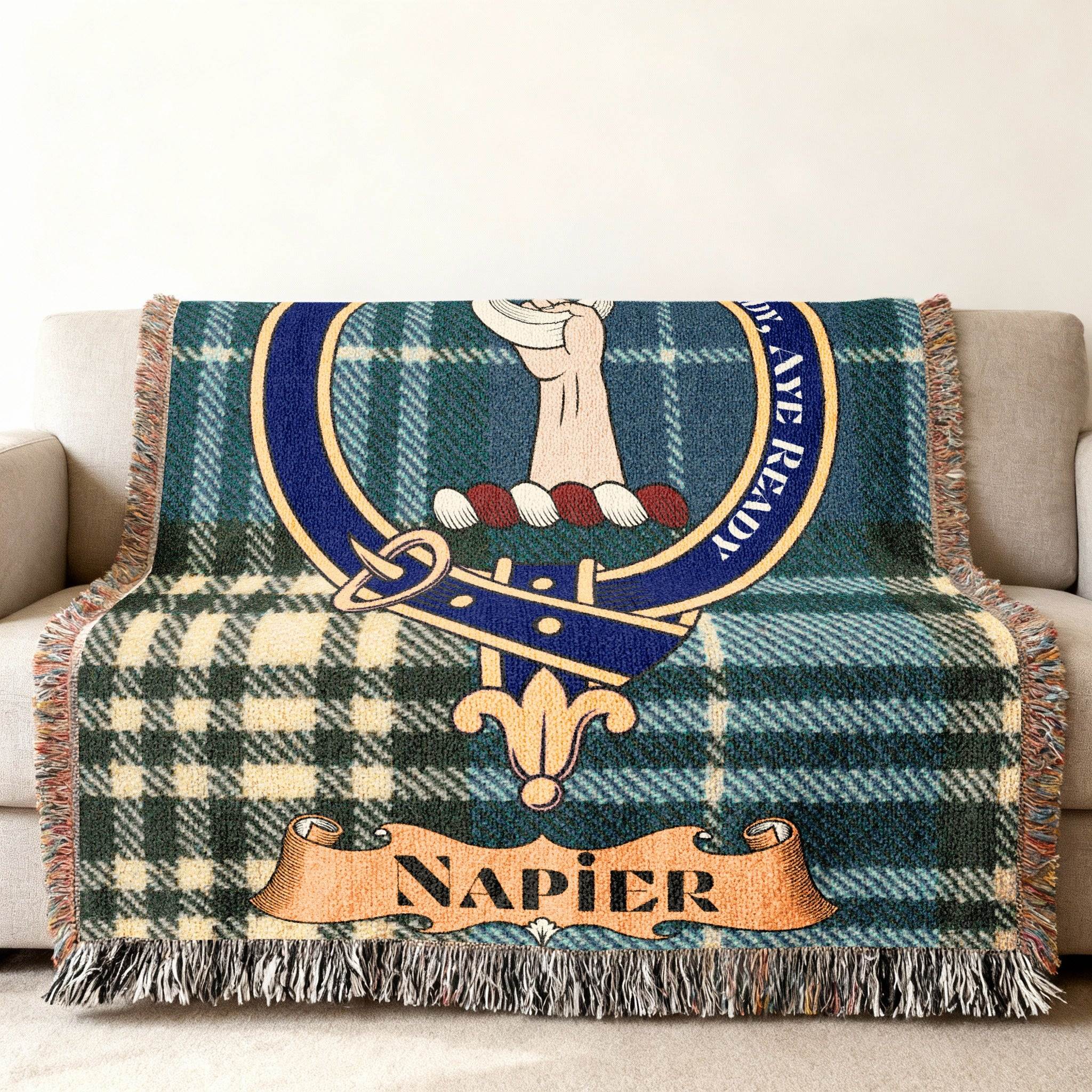 Napier tartan woven blanket folded — showing crest and plaid design
