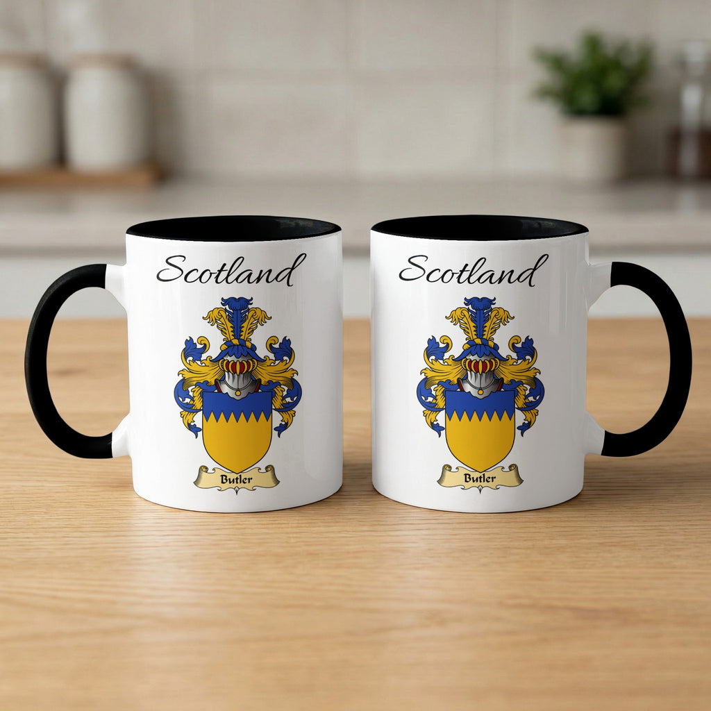 Pair of black-accent Butler mugs showing the double-sided Scottish family shield design on white ceramic.