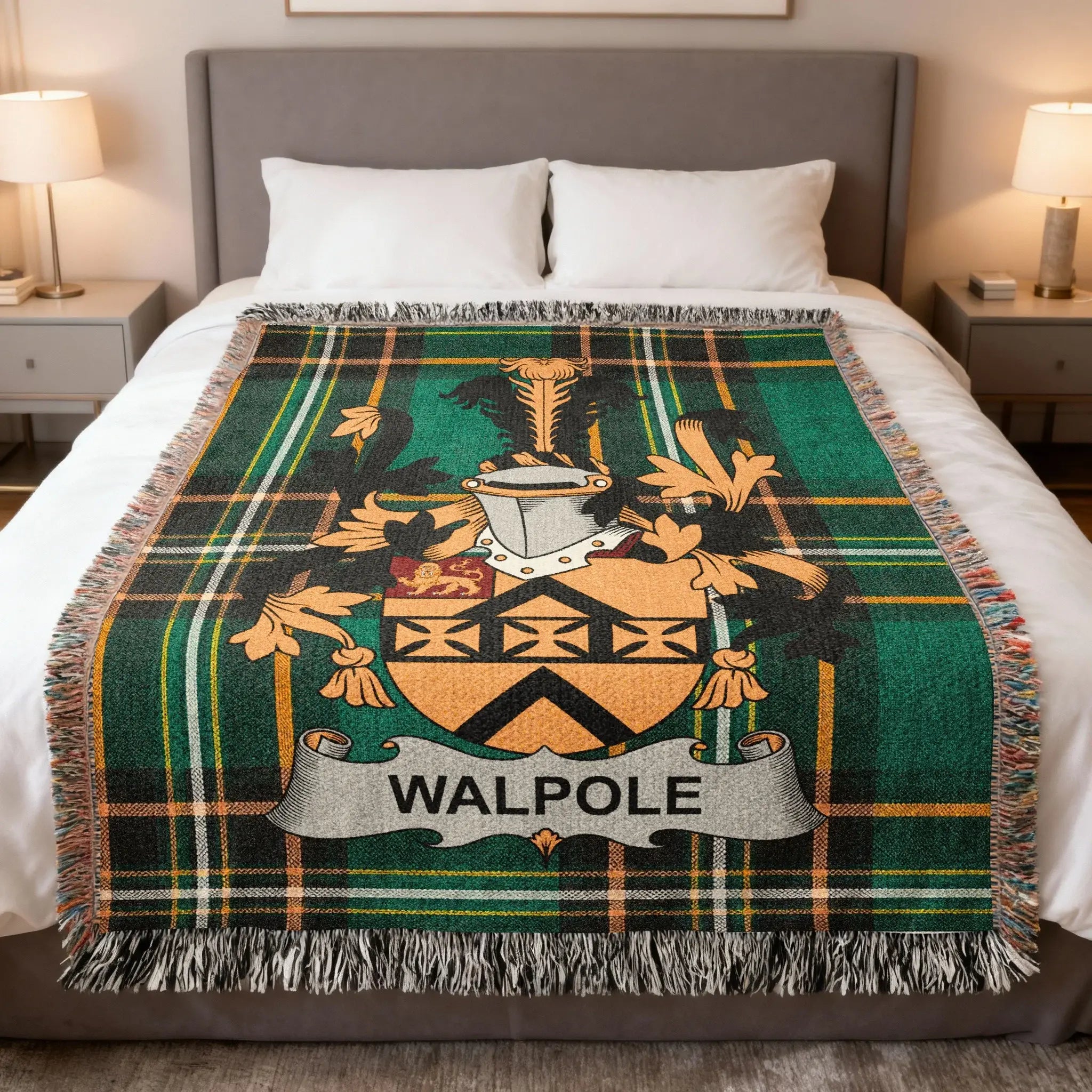Walpole tartan blanket with coat of arms on a bed.