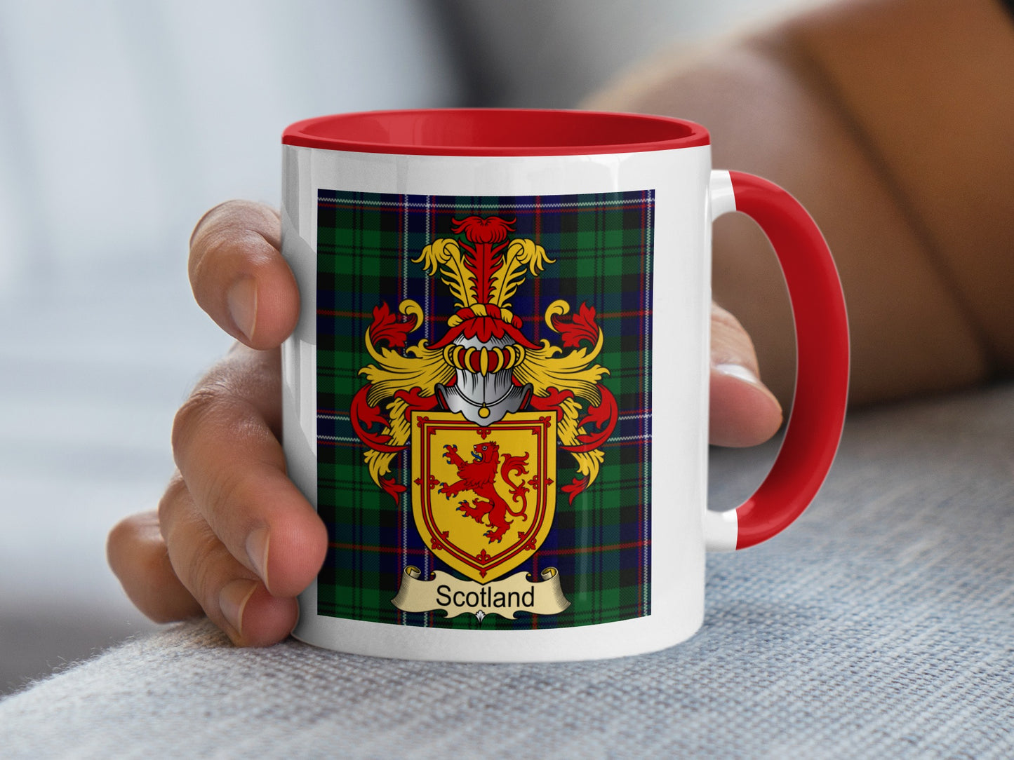 Mug with Scottish crest and tartan pattern.