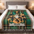 Green plaid blanket with a coat of arms and the name "Giles".