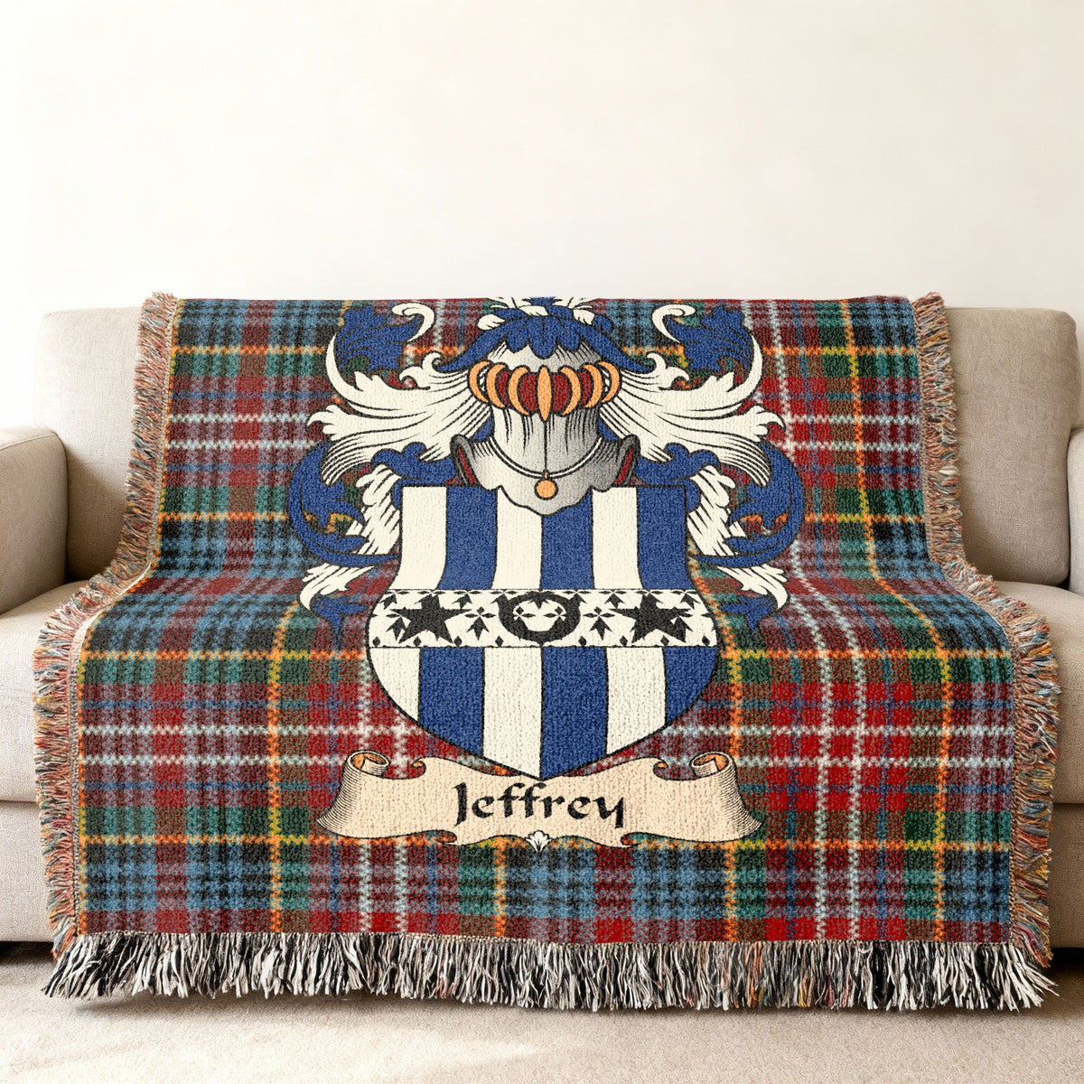 Jeffrey family crest emblem on a Caledonia tartan woven blanket