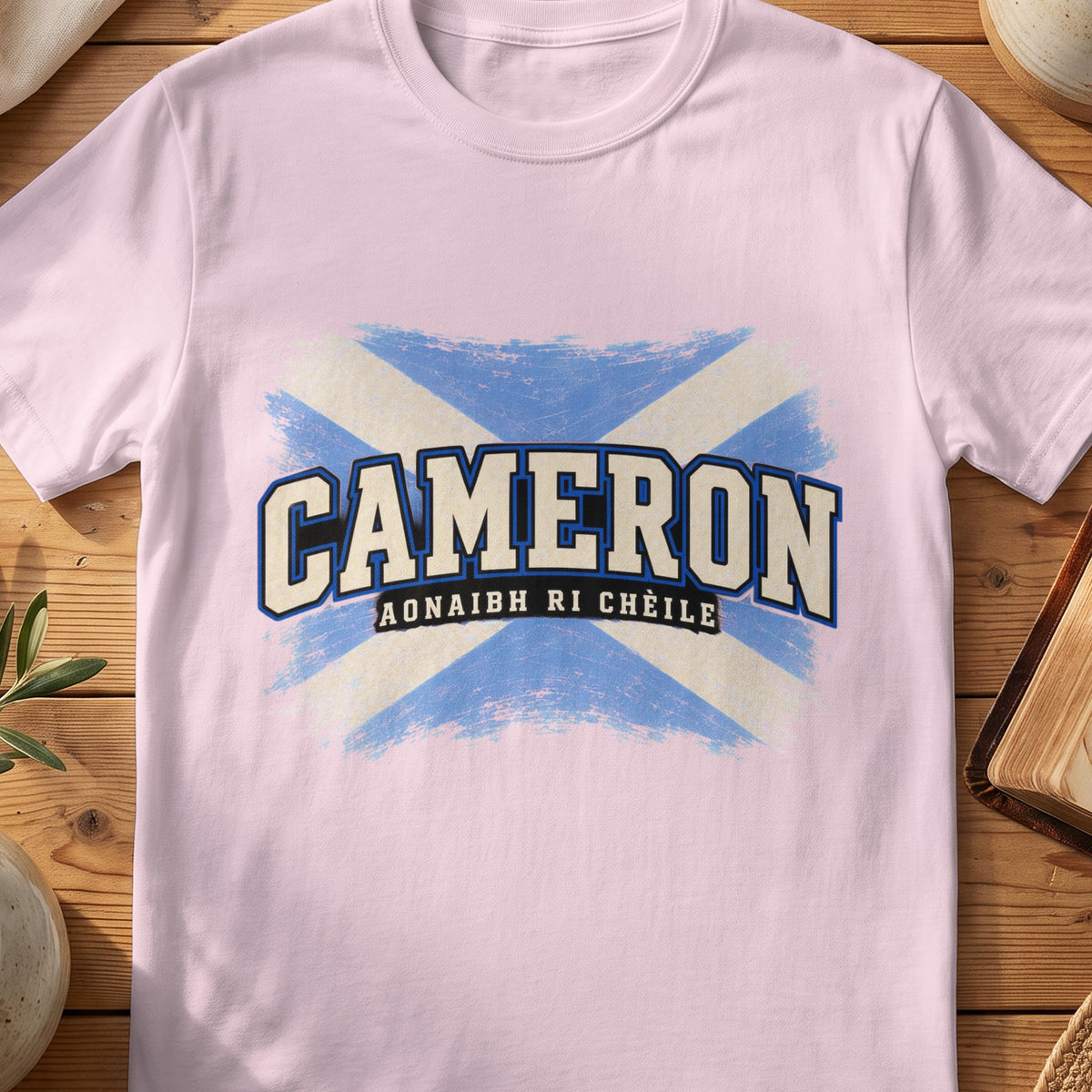 Cameron Scottish Saltire T-shirt in Light Pink, with distressed blue and cream flag and “Aonaibh Ri Chèile” lettering.