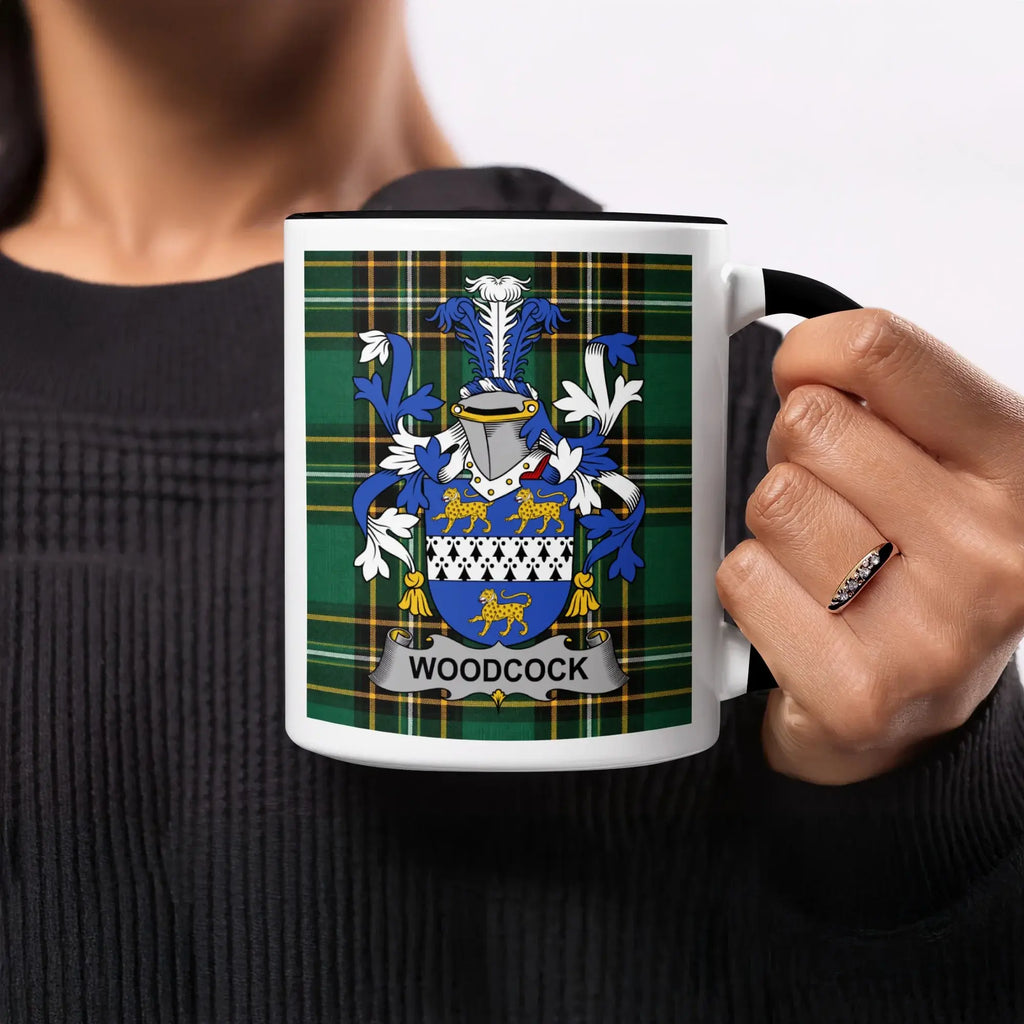 Mug with Woodcock family crest on a tartan background.
