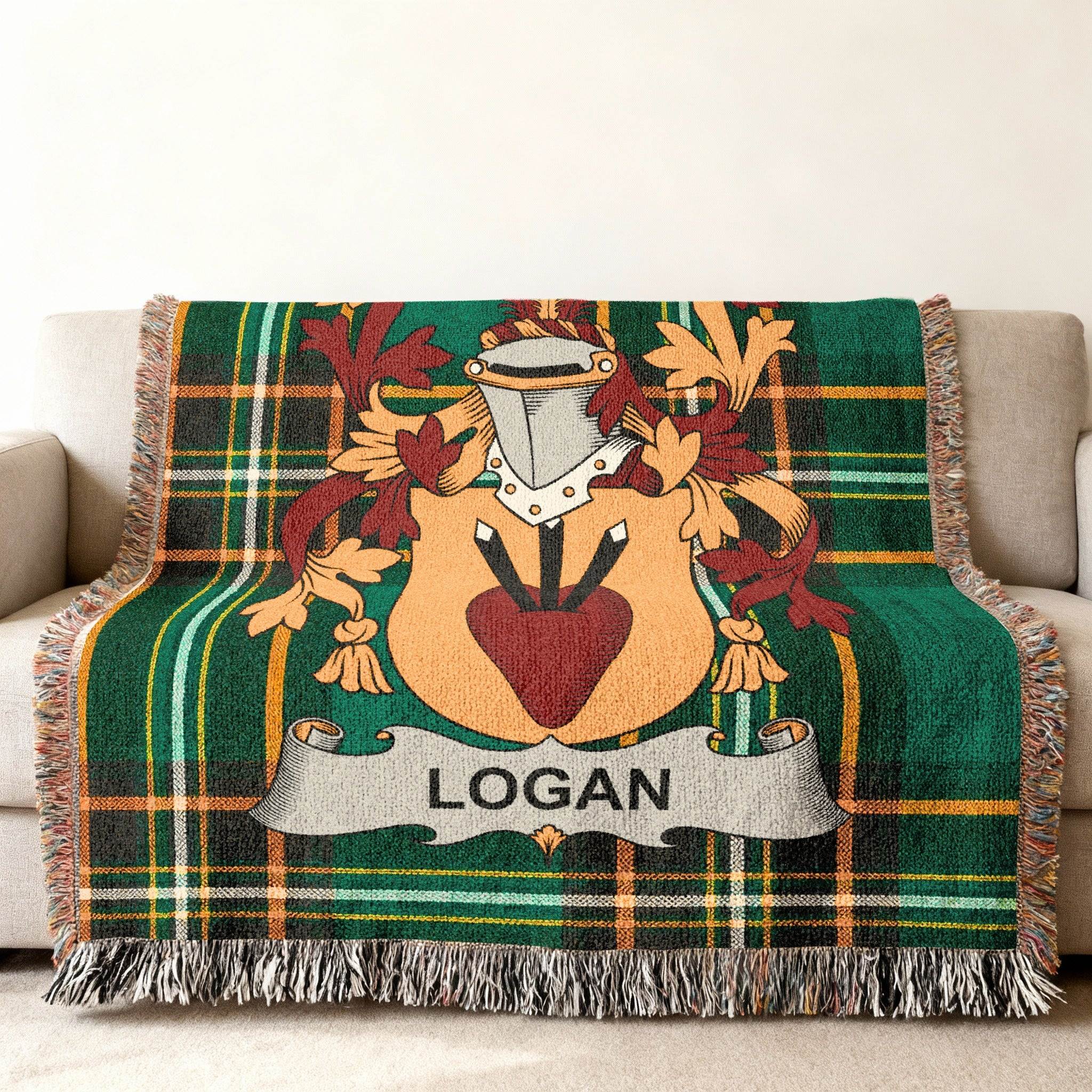 Green tartan blanket featuring the Logan family crest with a heart and shield.