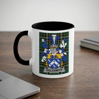 White mug with black rim displaying the Goldsmith family crest on a checkered background.
