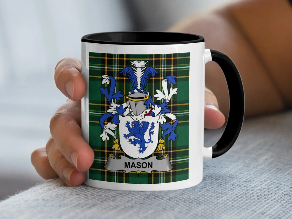 White mug with black rim featuring the Mason family crest on a green tartan background.