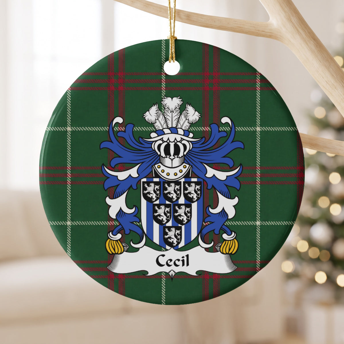 Cecil ornament hanging from a pale wooden branch; six small black shields bearing white lions over blue-and-white vertical stripes on Welsh national tartan.