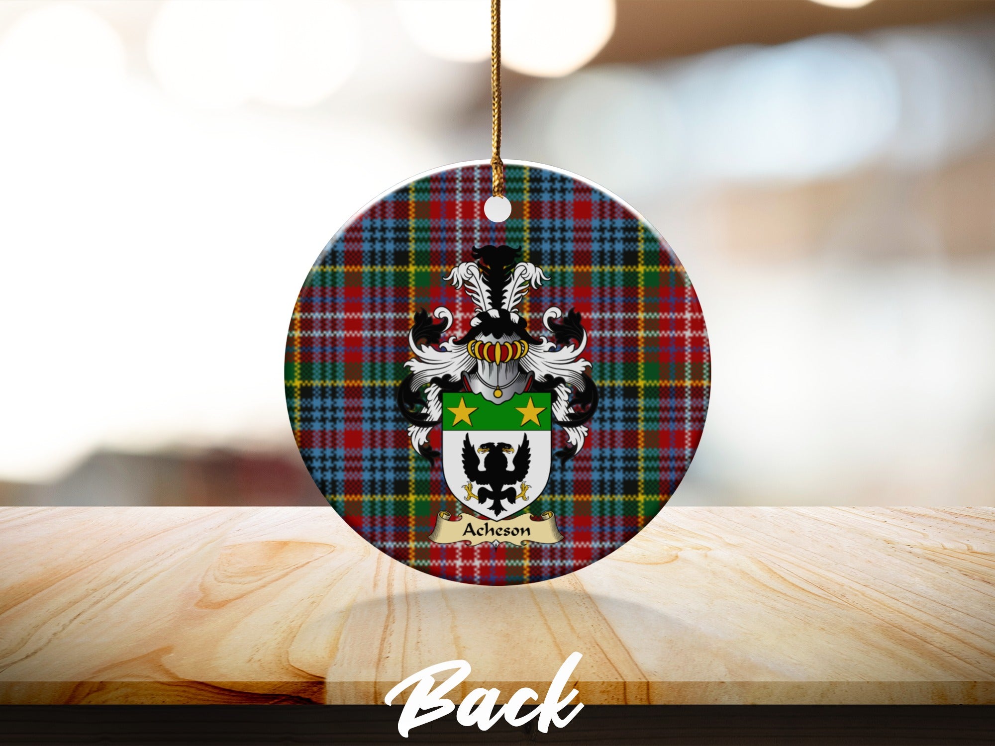 Round Acheson Scottish clan ornament with family crest on a Caledonia tartan background