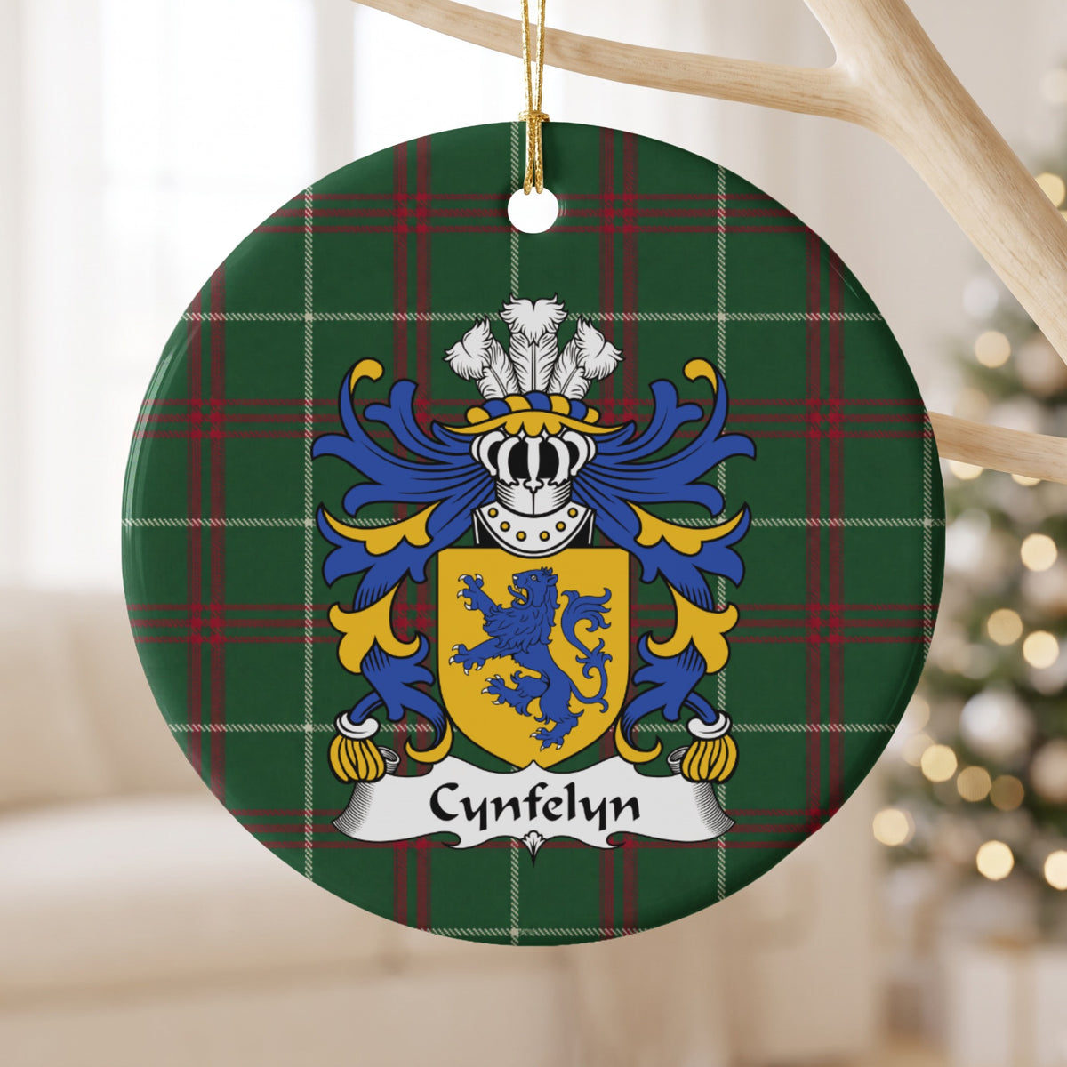Cynfelyn ornament hanging from a pale wooden branch; a blue upright lion on a gold shield on Welsh national tartan.