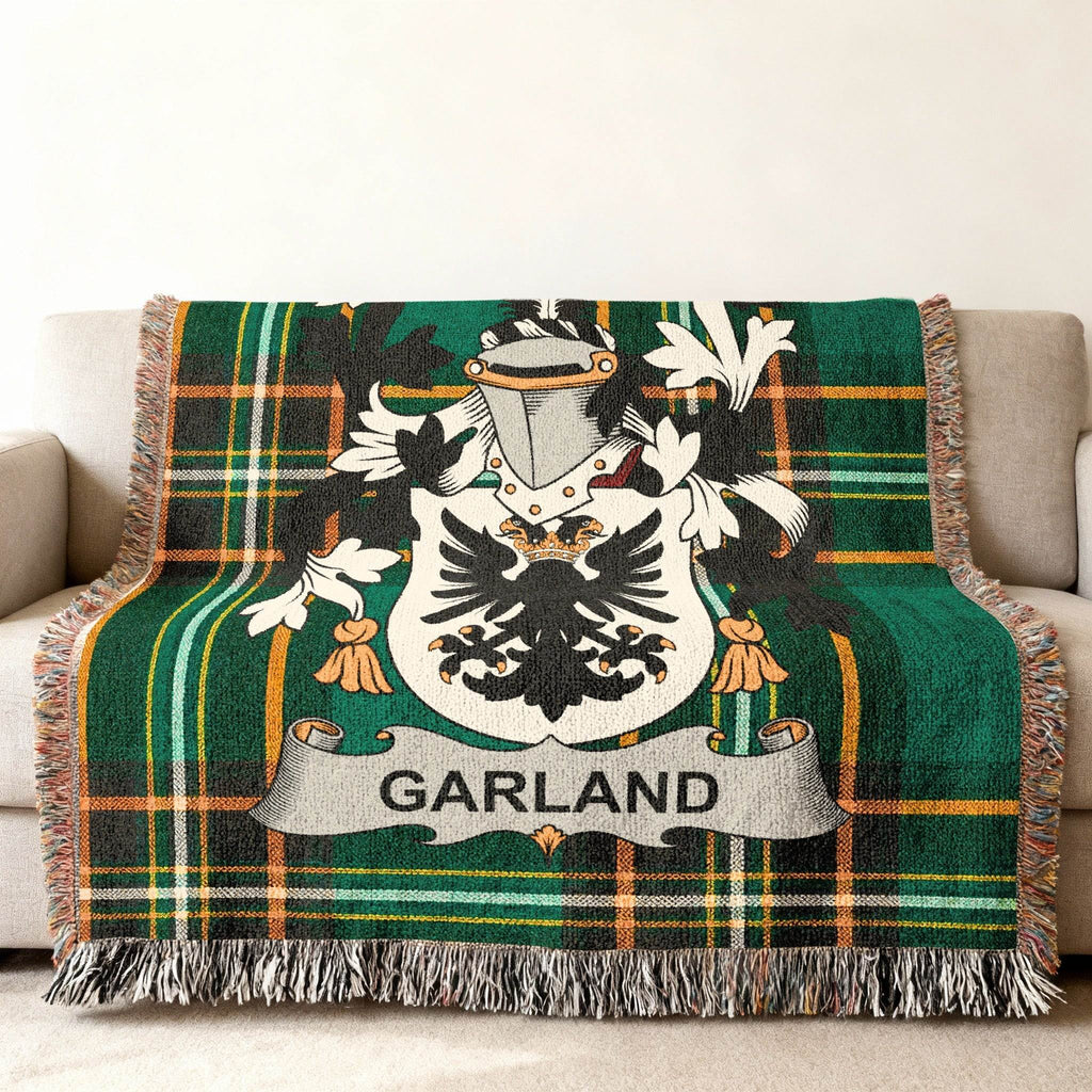 Green tartan throw blanket with black eagle crest and "GARLAND" banner.