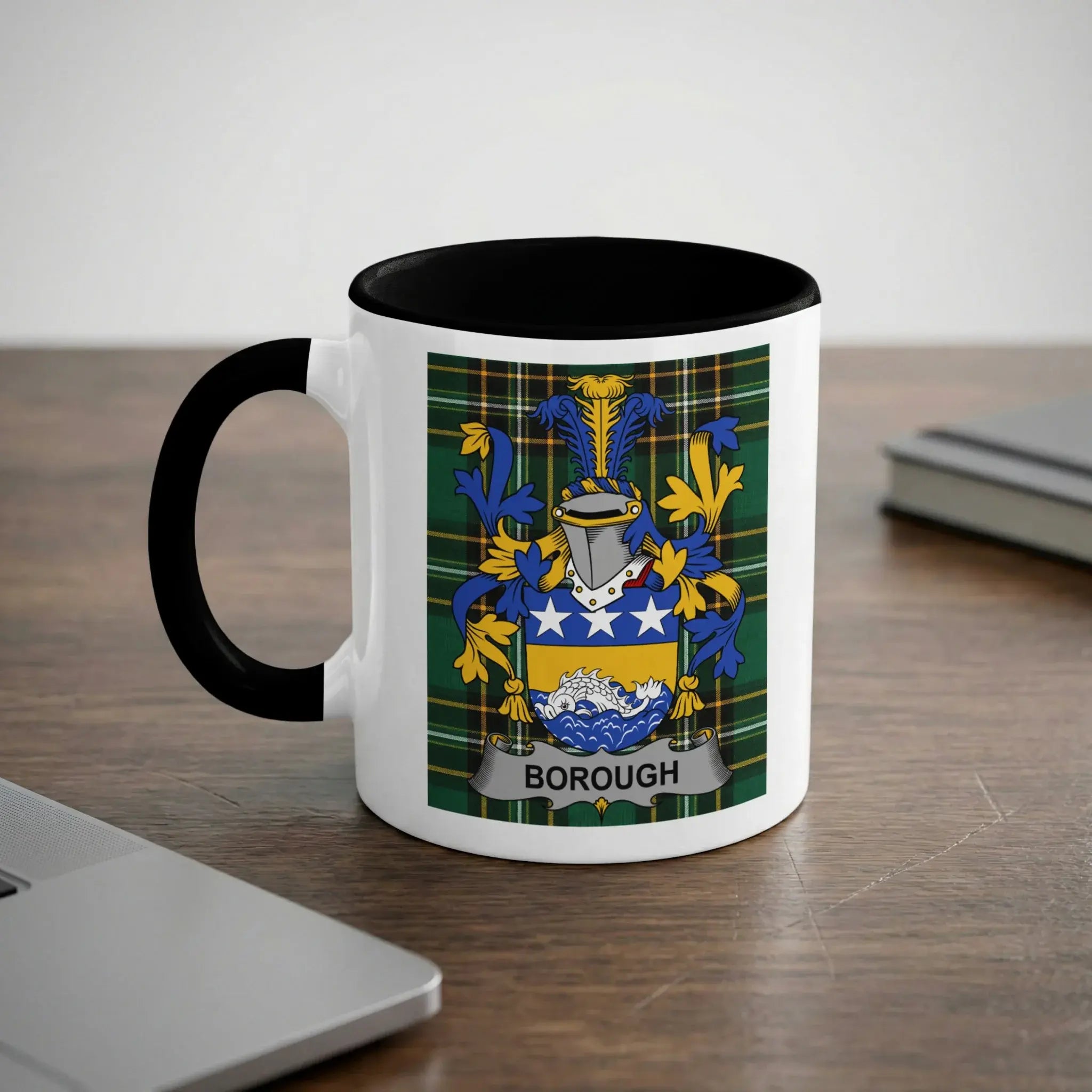 White mug with black rim featuring a family crest with the text "Borough".
