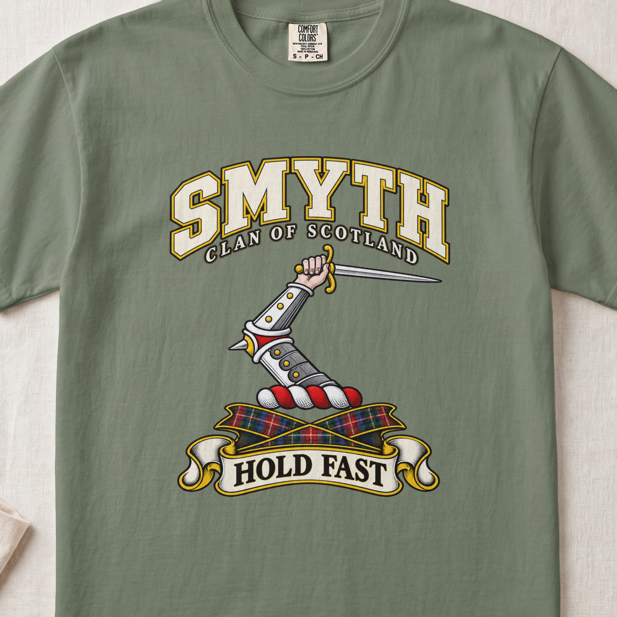 Smyth Scottish clan T-shirt in Moss, front view with an armoured arm holding a dagger and motto design.