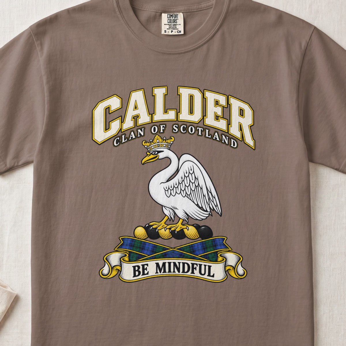 Calder Scottish clan T-shirt in Espresso, front view with a white swan wearing a gold crown and motto banner.