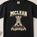 McLean graphic T-shirt in Black, front flat lay showing varsity lettering and white stone tower with battlements and arched doorway.