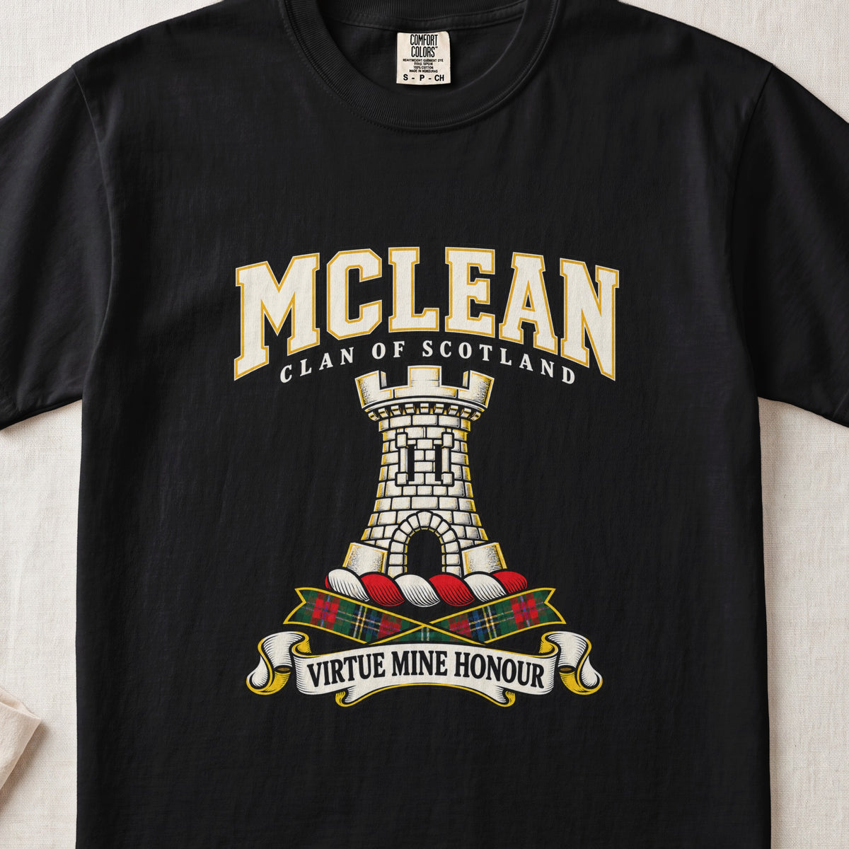 McLean graphic T-shirt in Black, front flat lay showing varsity lettering and white stone tower with battlements and arched doorway.