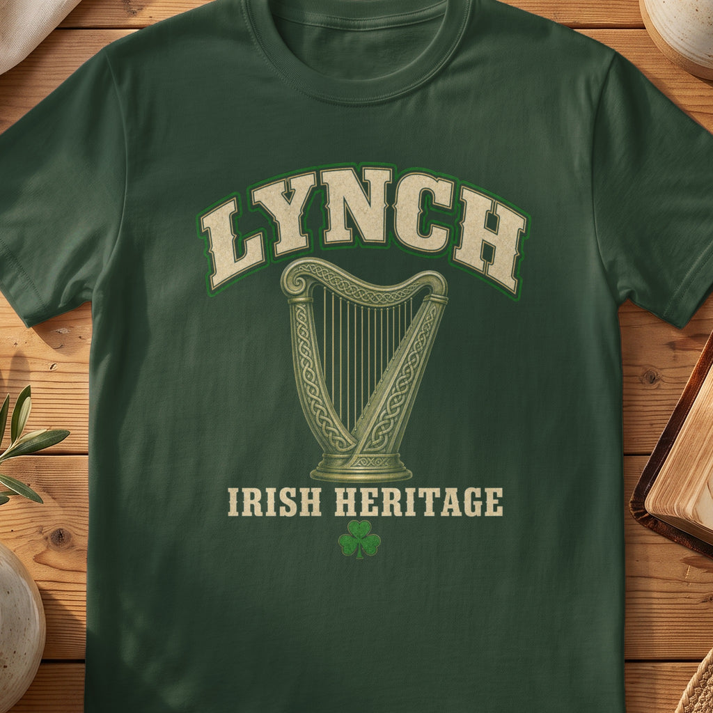 Lynch Irish harp T-shirt in Forest Green, with cream surname lettering, a gold-toned harp, green shamrock and “Irish Heritage” text.