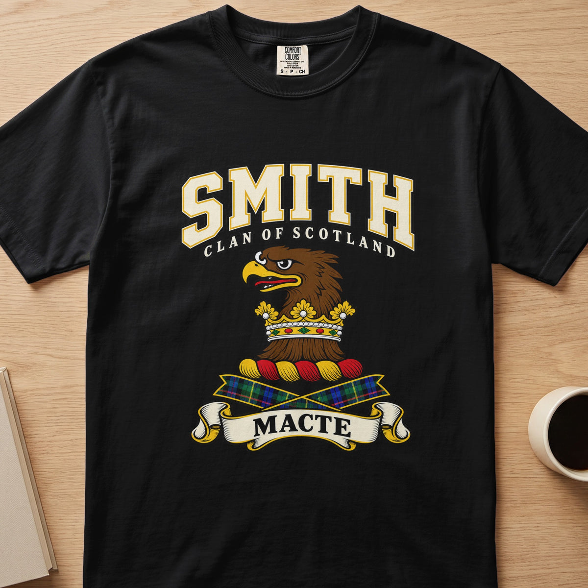Smith brown eagle-head crest with gold accents graphic on a black Comfort Colors T-shirt, front view